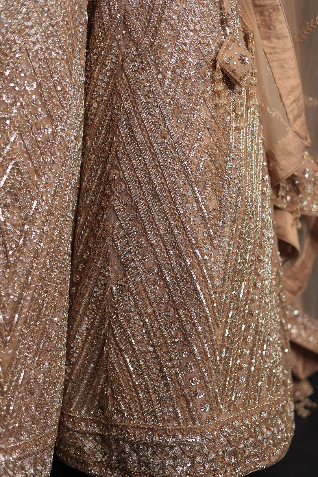 Net Lehenga with Cutdana embroidery.