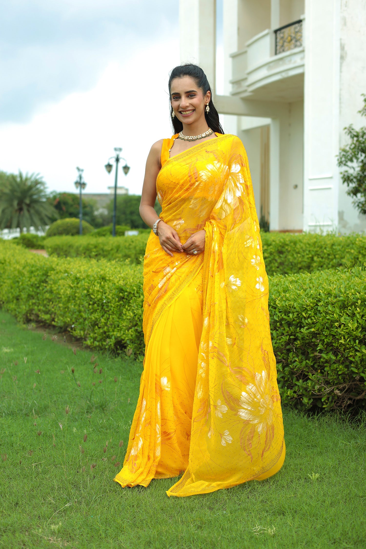 Yellow Chiffon Saree Adorned with Swarovski and Foil print