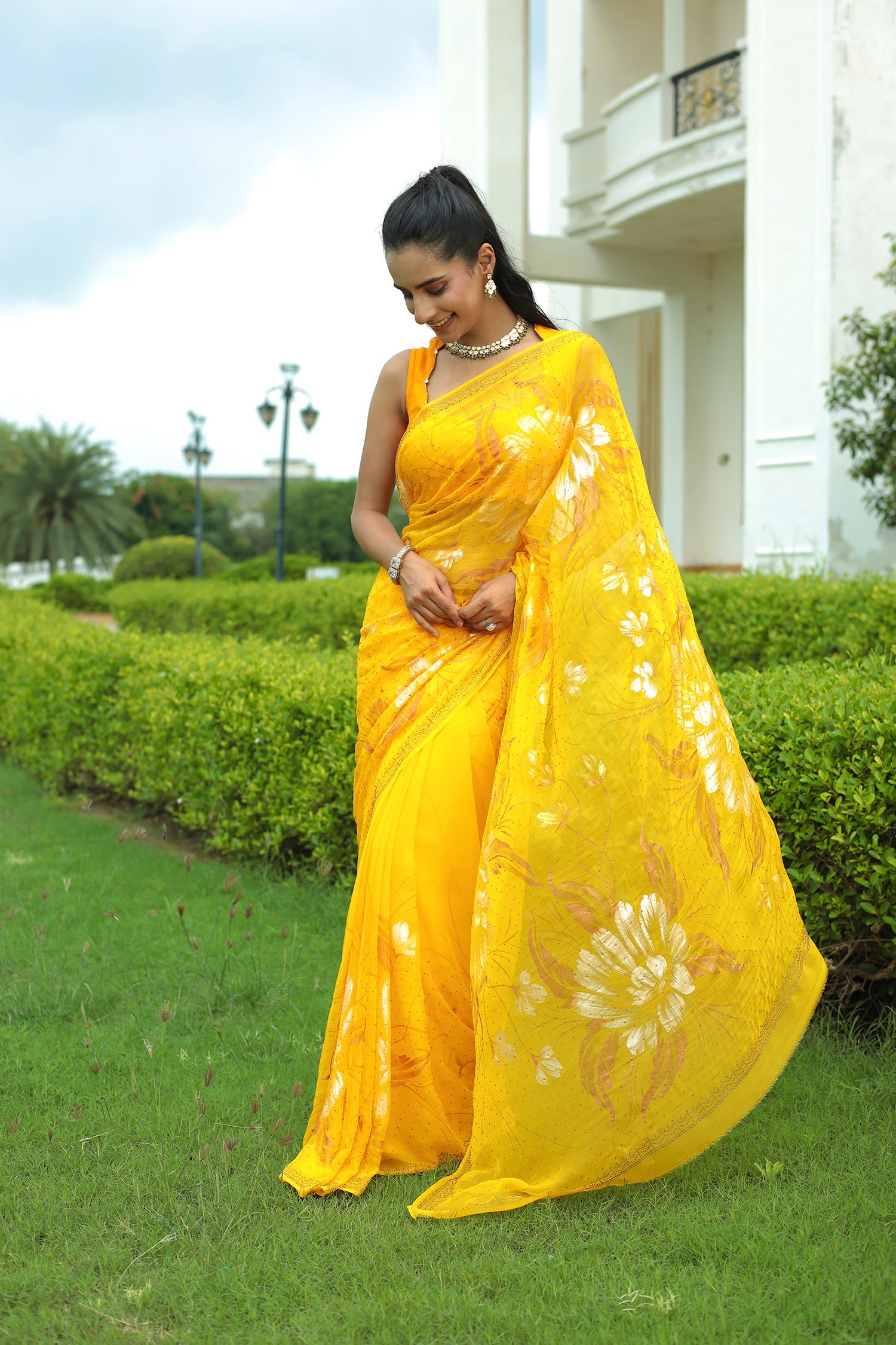 Yellow Chiffon Saree Adorned with Swarovski and Foil print