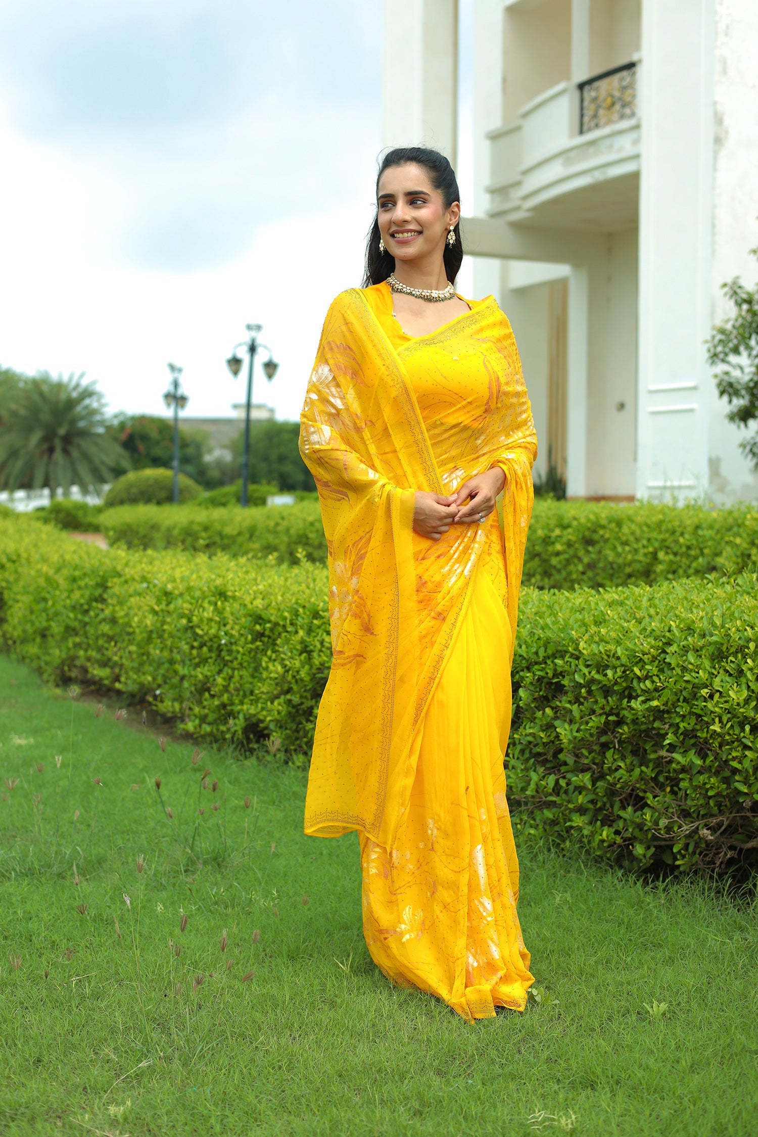 Yellow Chiffon Saree Adorned with Swarovski and Foil print