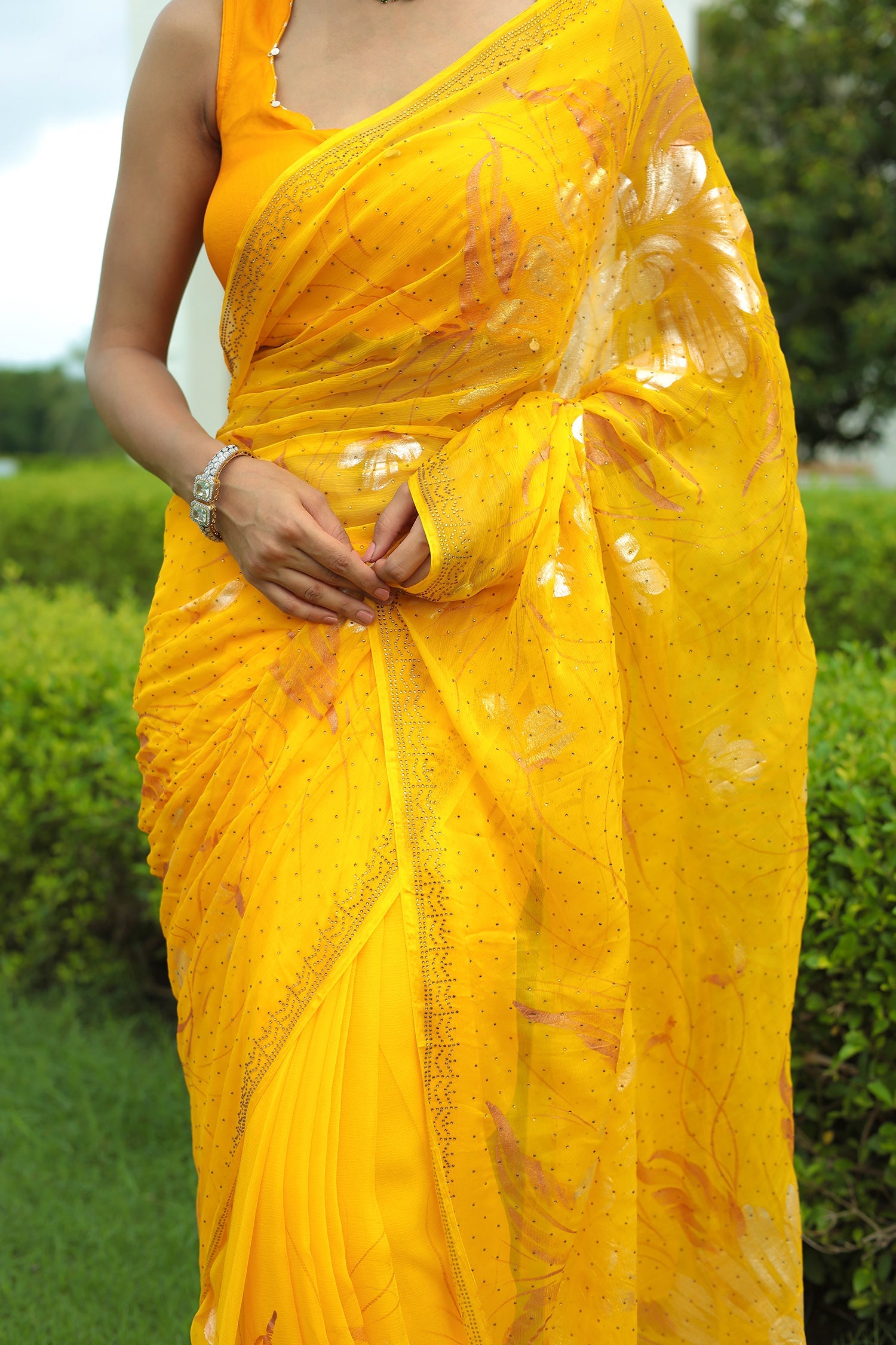 Yellow Chiffon Saree Adorned with Swarovski and Foil print