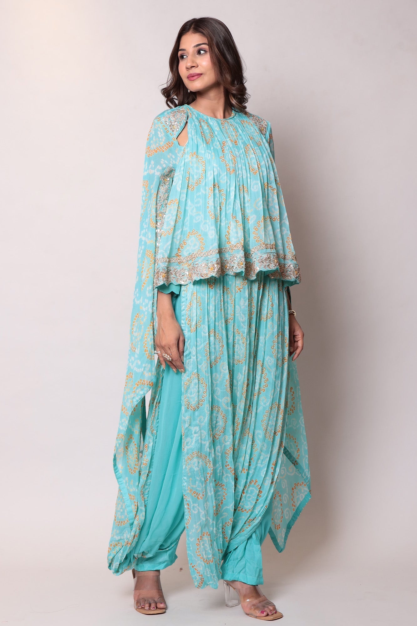 Georgette Bandhej Dhoti style jumpsuit with extended sleeves and peek-a-boo at shoulders.