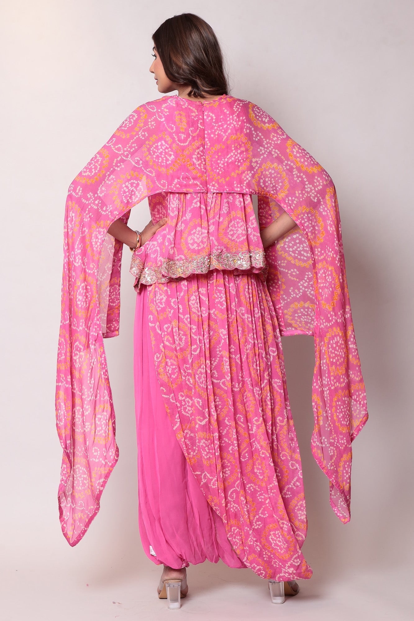 Georgette Bandhej Dhoti style jumpsuit with extended sleeves and peek-a-boo at shoulders.
