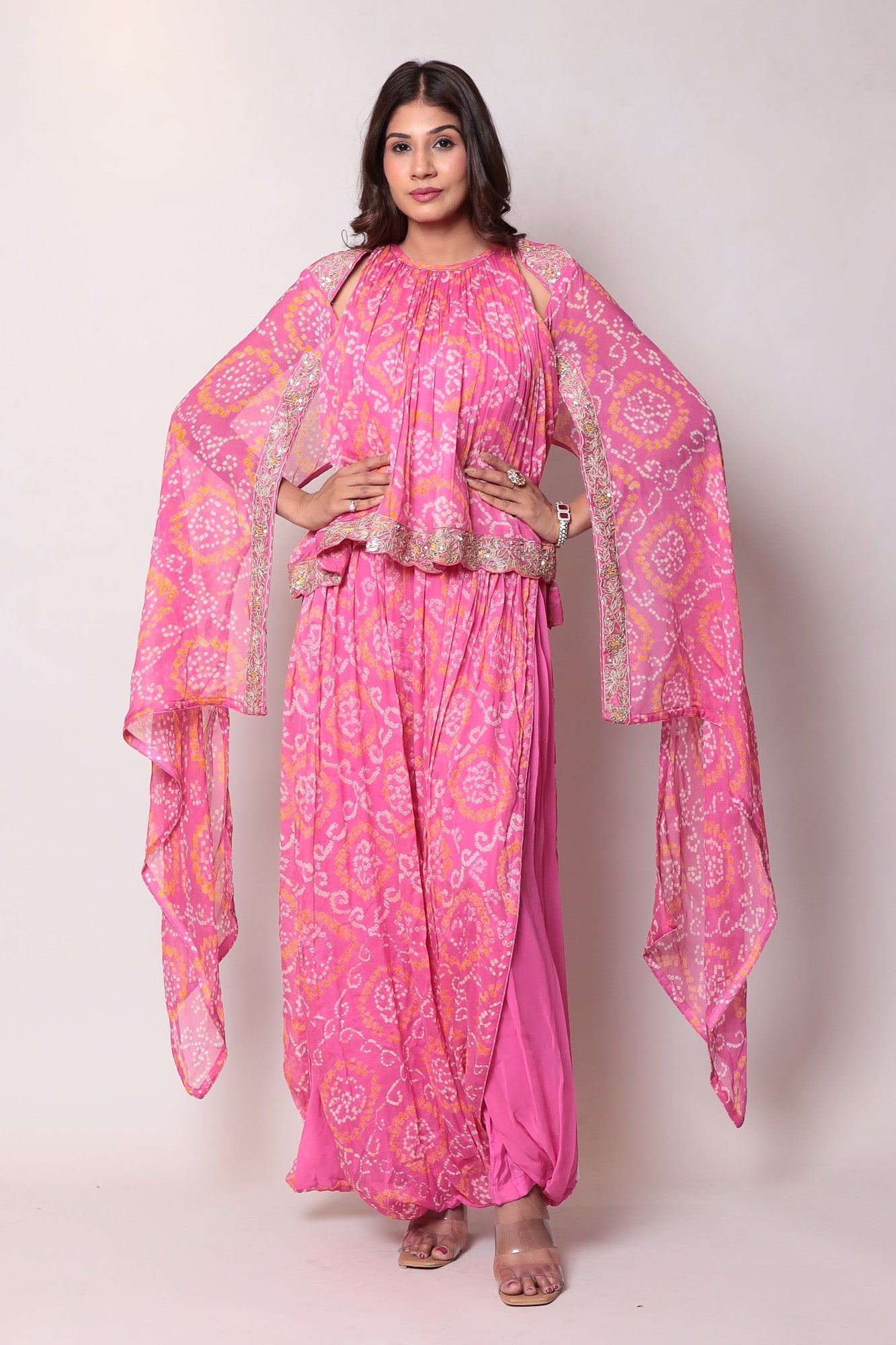 Georgette Bandhej Dhoti style jumpsuit with extended sleeves and peek-a-boo at shoulders.