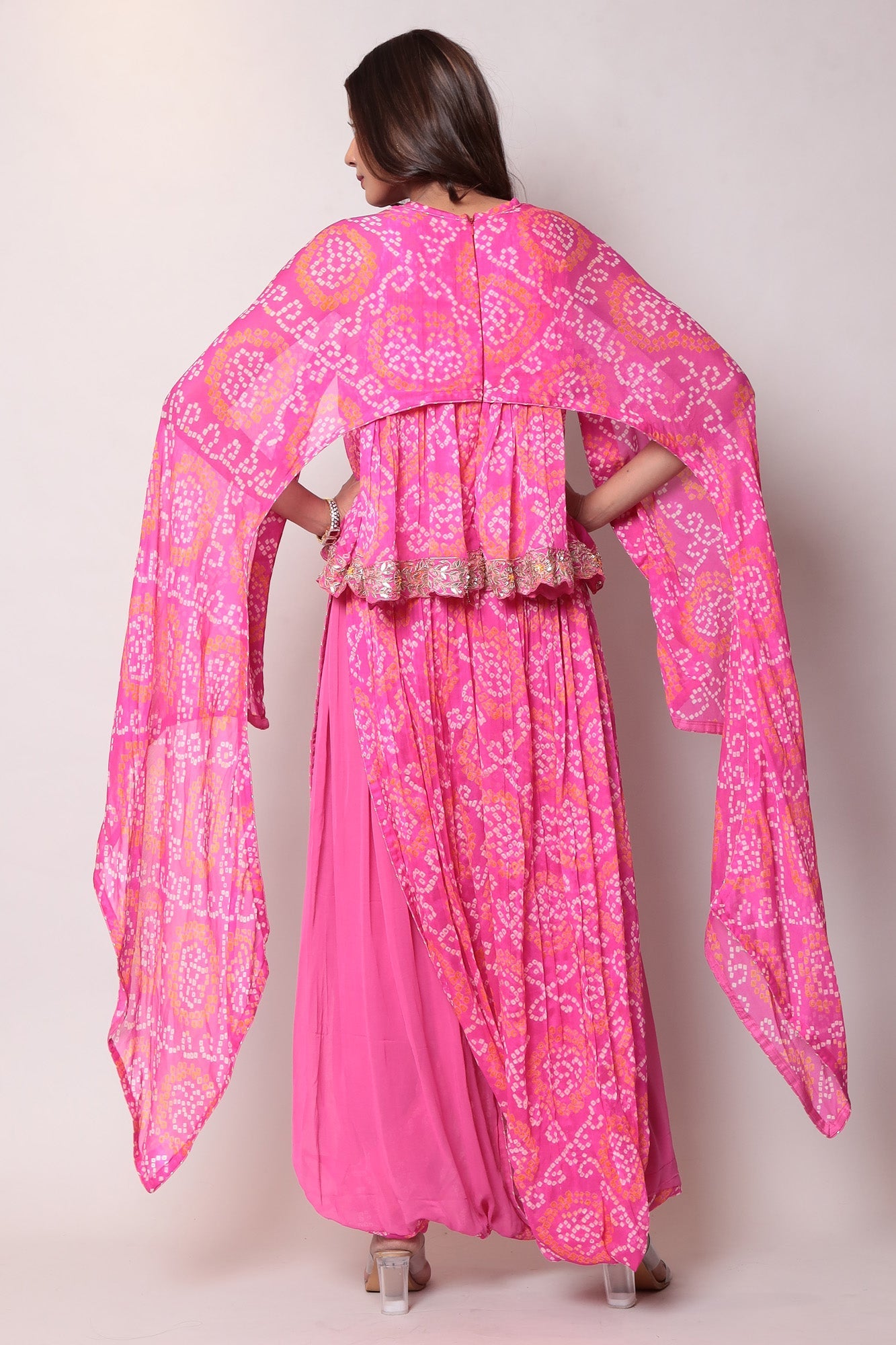 Georgette Bandhej Dhoti style jumpsuit with extended sleeves and peek-a-boo at shoulders.