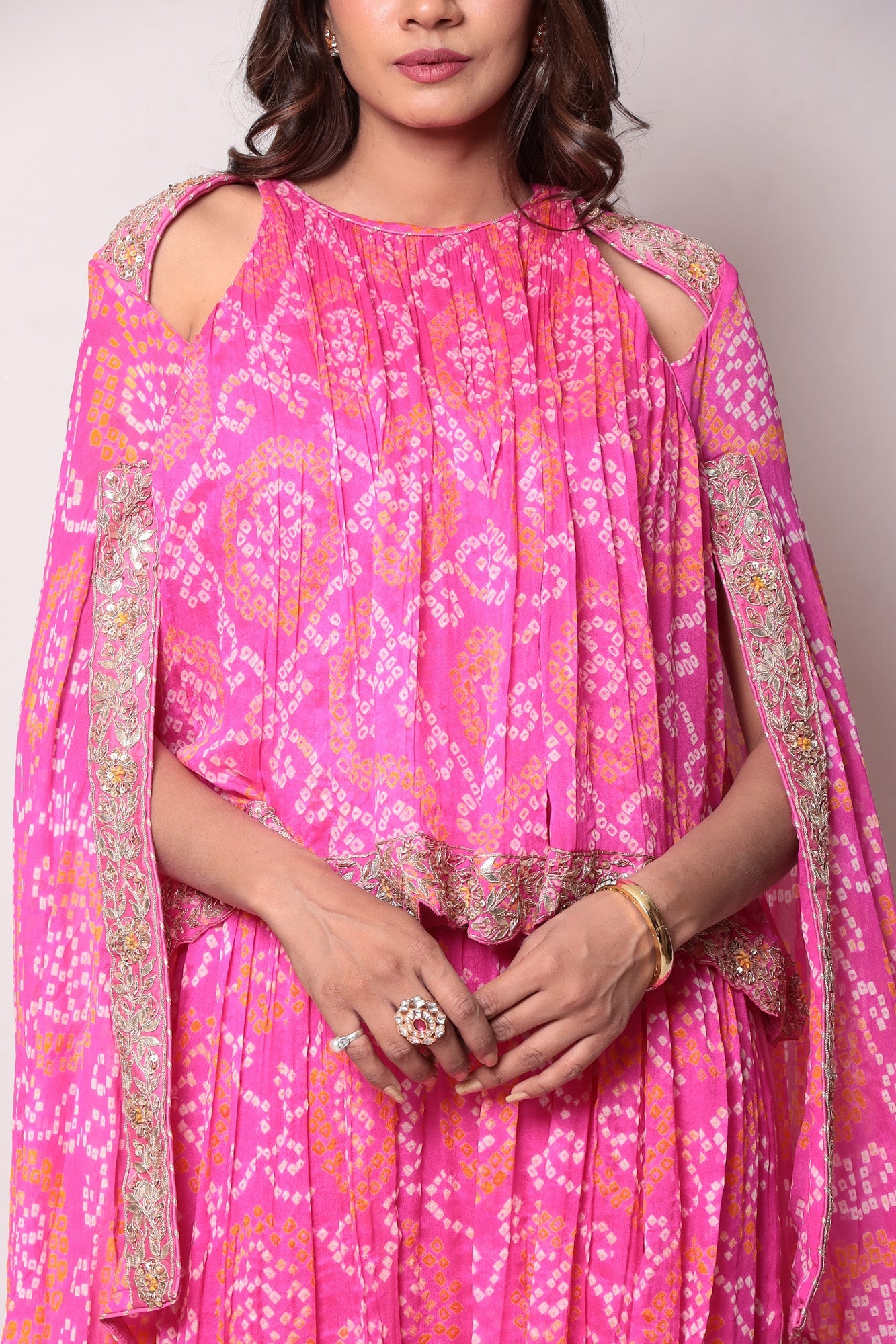 Georgette Bandhej Dhoti style jumpsuit with extended sleeves and peek-a-boo at shoulders.