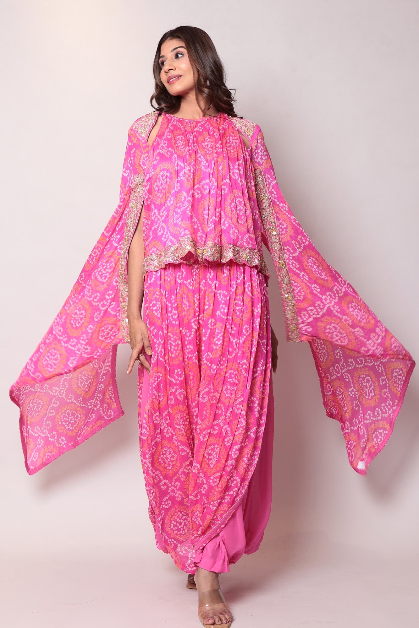 Georgette Bandhej Dhoti style jumpsuit with extended sleeves and peek-a-boo at shoulders.