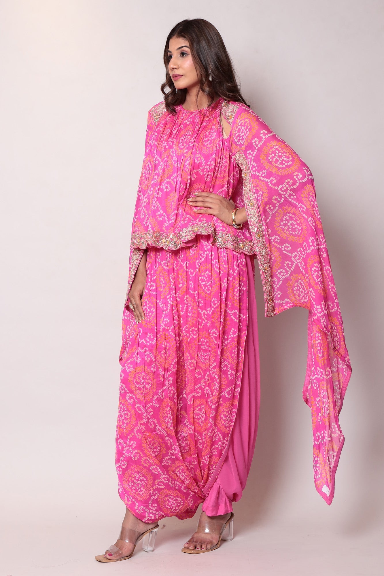 Georgette Bandhej Dhoti style jumpsuit with extended sleeves and peek-a-boo at shoulders.