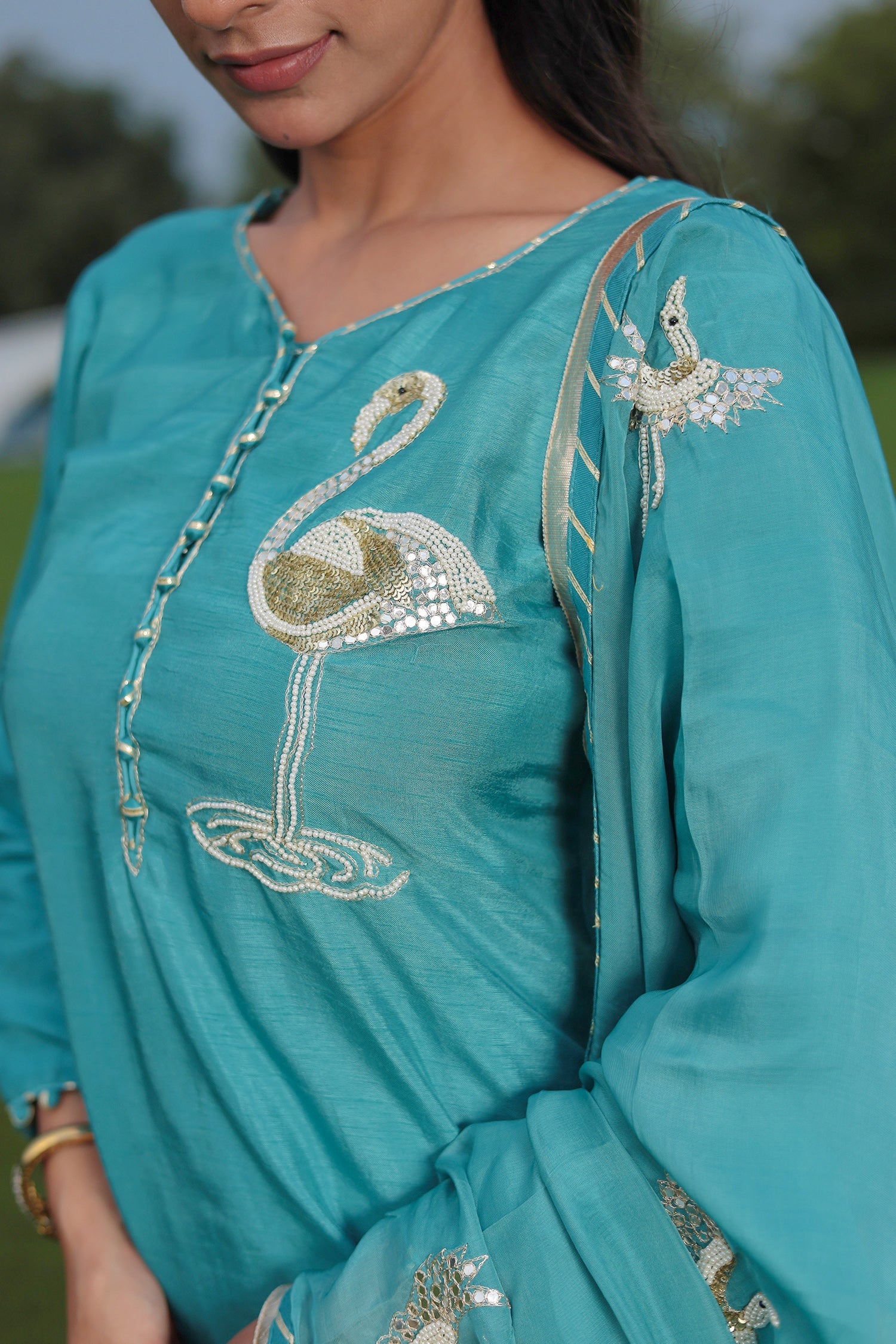 Festive Silk Suit Enhanced with Aari, Gota, Pearl & Sequins Embellishment