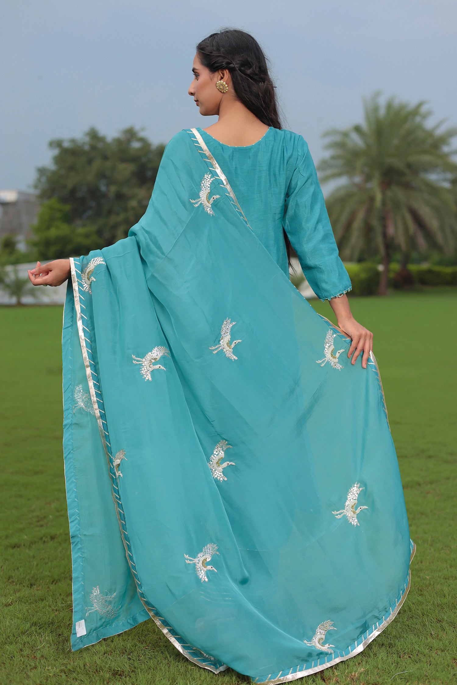 Festive Silk Suit Enhanced with Aari, Gota, Pearl & Sequins Embellishment