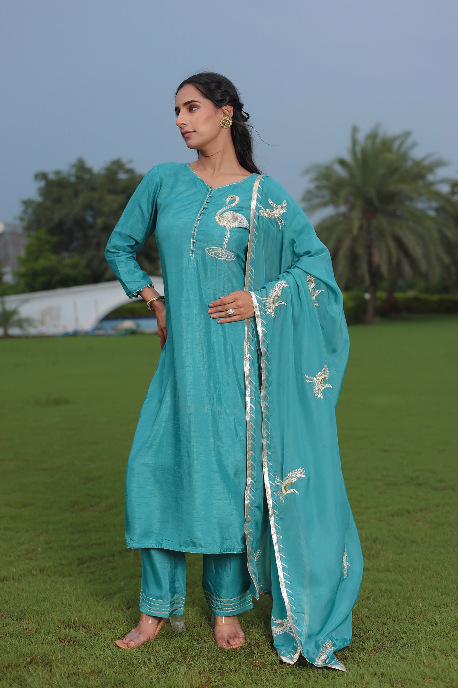 Festive Silk Suit Enhanced with Aari, Gota, Pearl & Sequins Embellishment