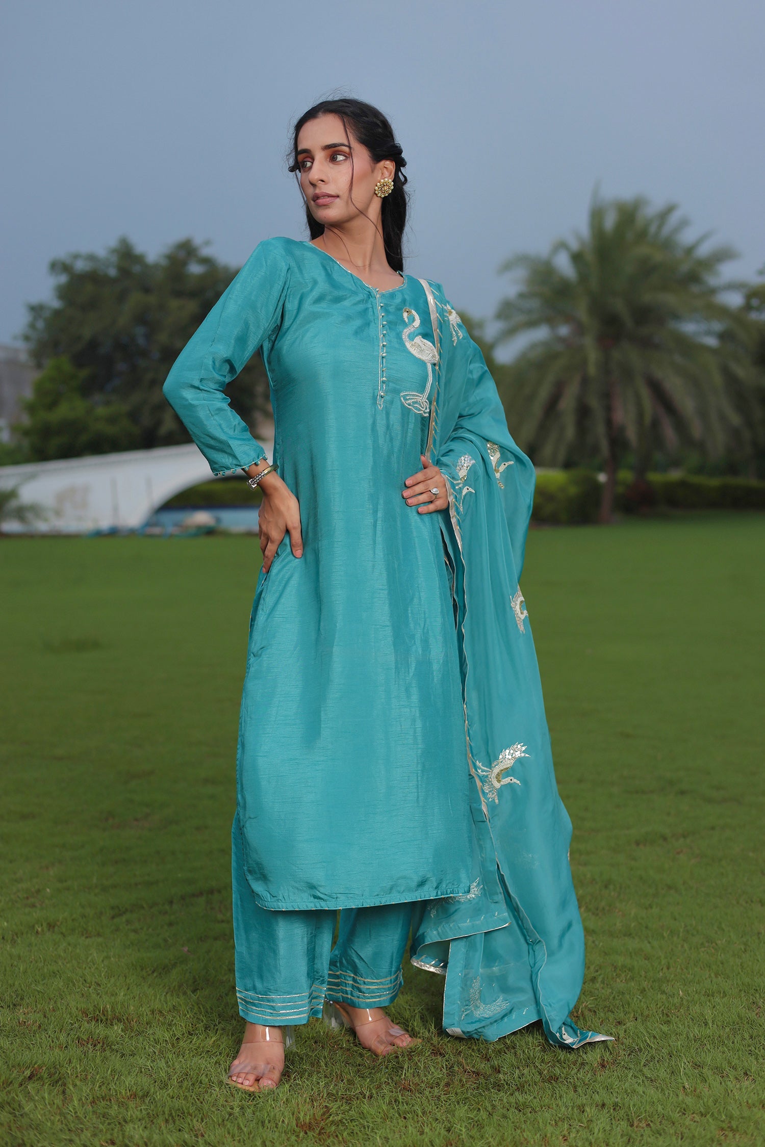 Festive Silk Suit Enhanced with Aari, Gota, Pearl & Sequins Embellishment