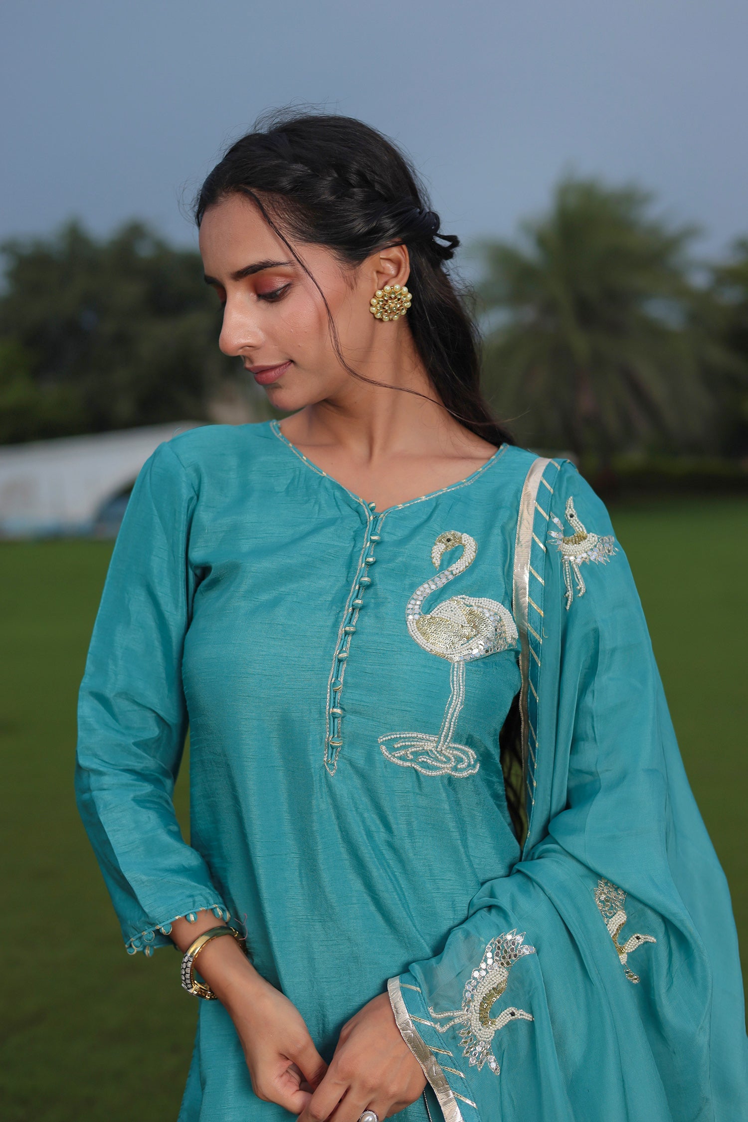 Festive Silk Suit Enhanced with Aari, Gota, Pearl & Sequins Embellishment