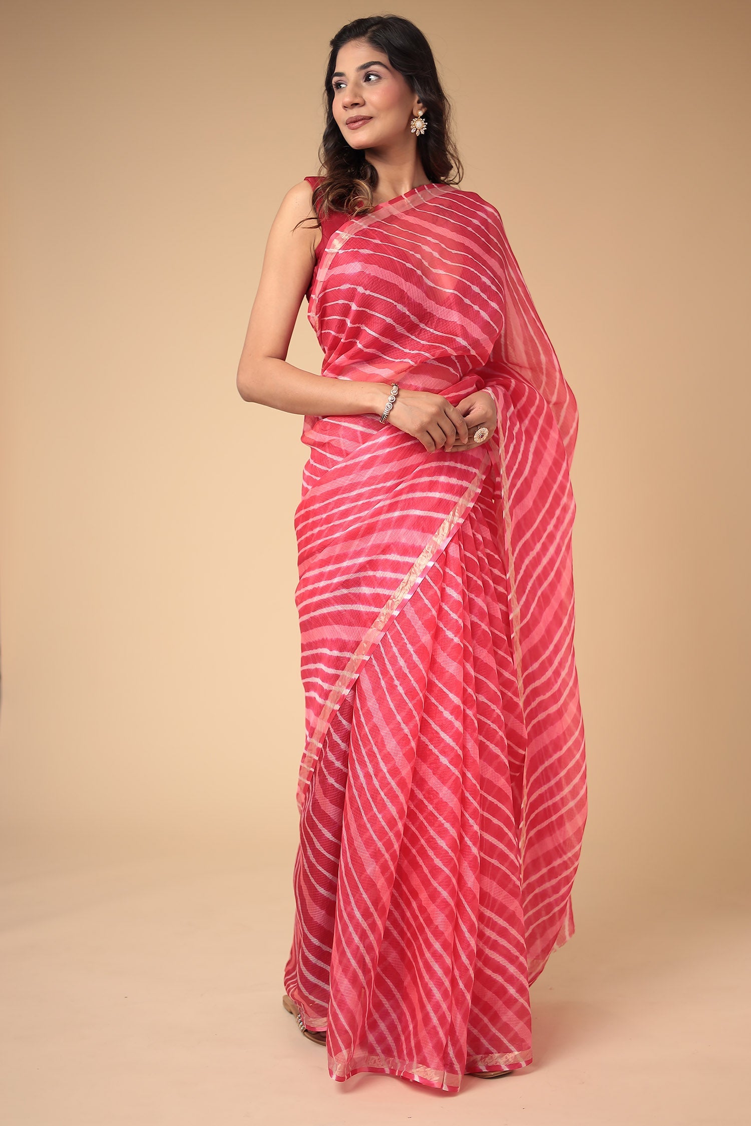 Kota Doria Silk Leheriya Saree with Zari work.