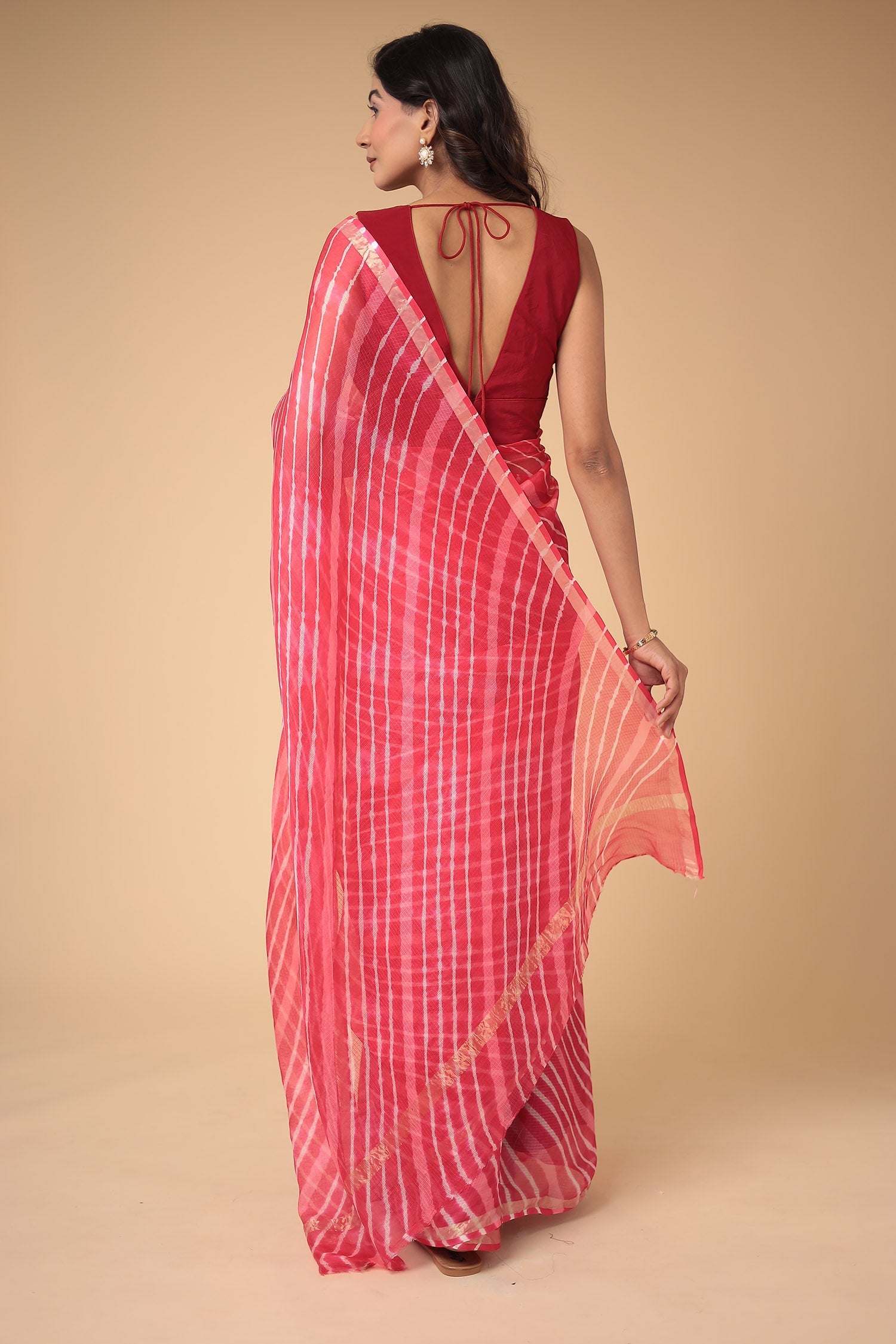 Kota Doria Silk Leheriya Saree with Zari work.