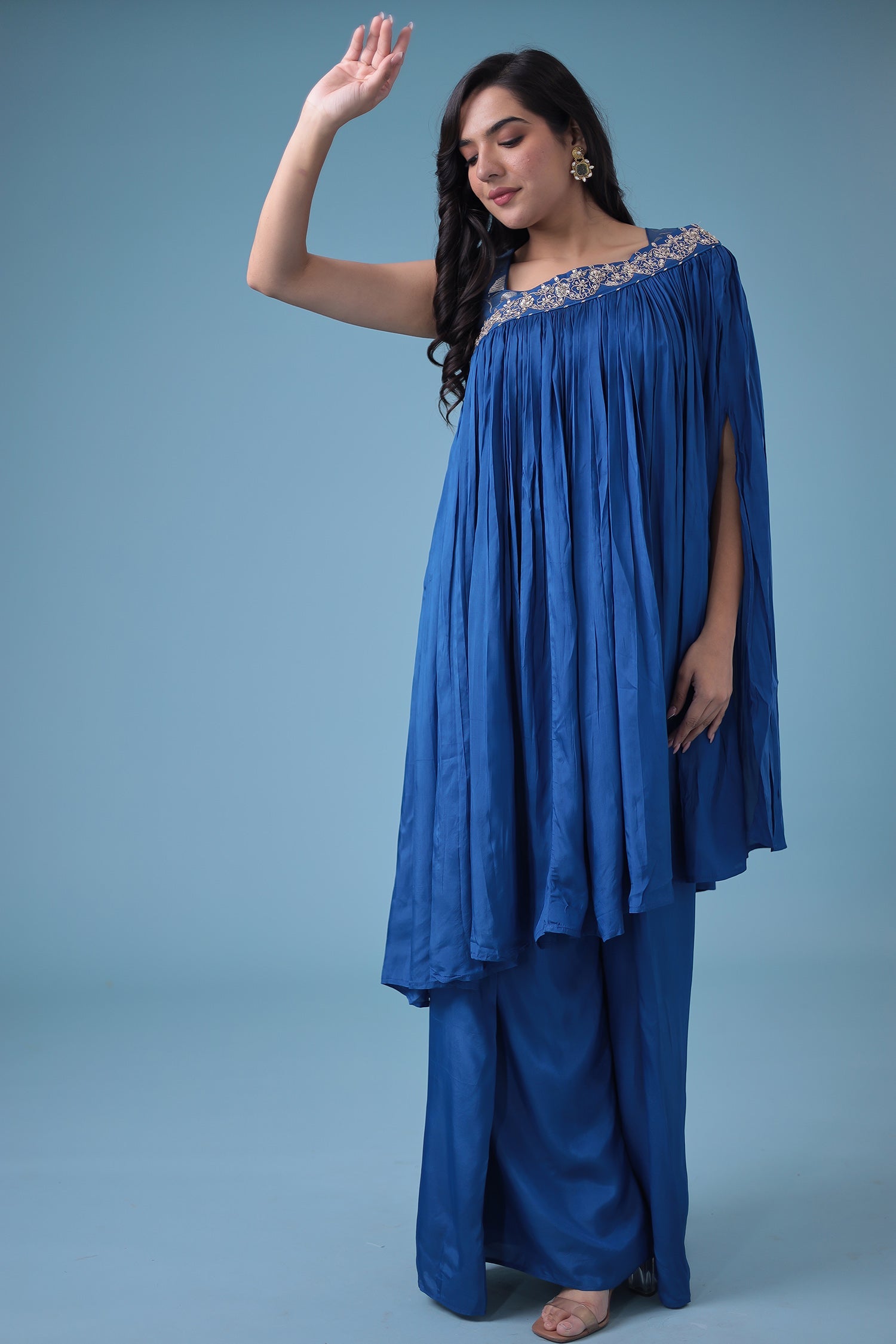 Exquisite Crop Top with Palazzo and a Draping Skirt Embellished with Zari and Dori work