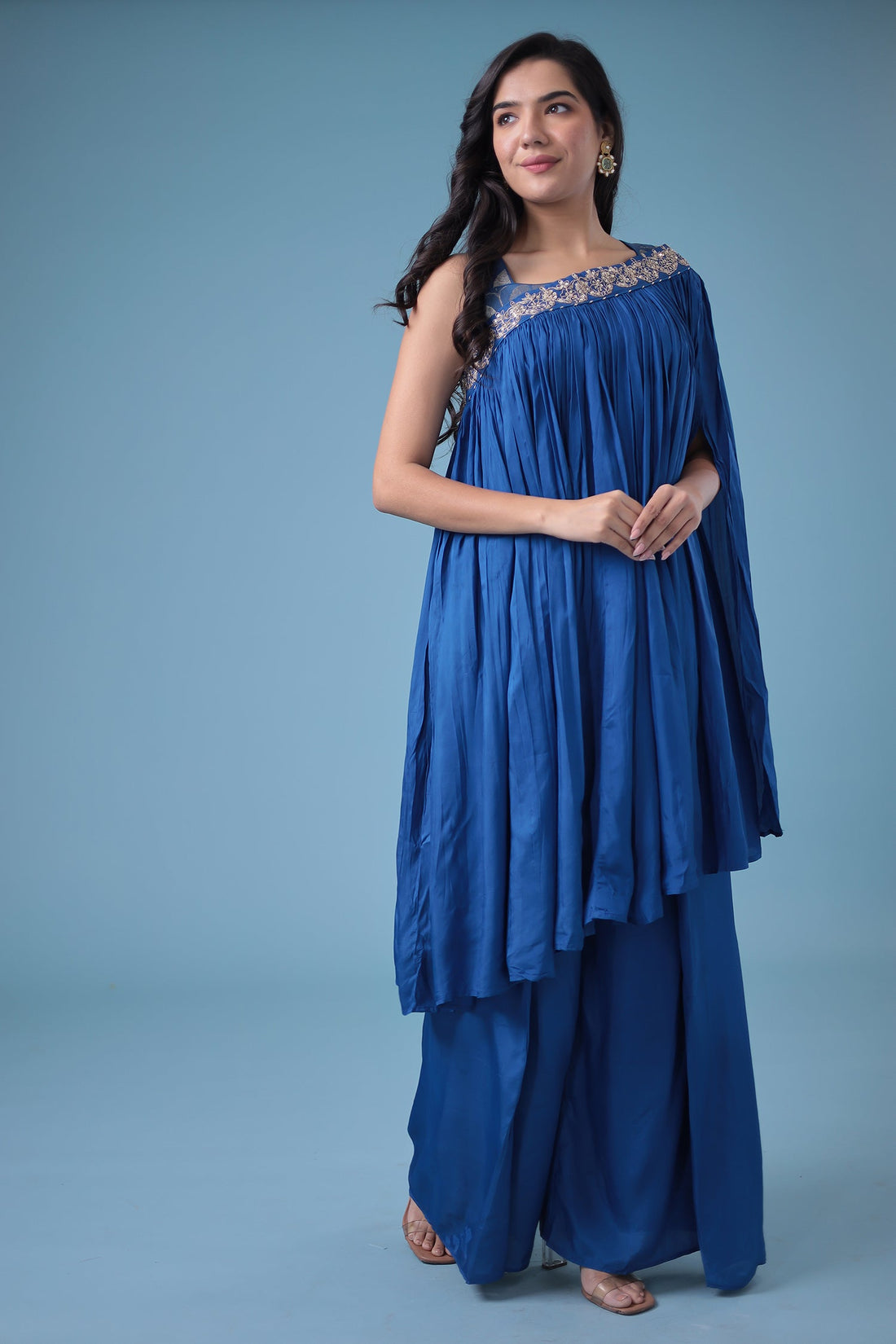 Exquisite Crop Top with Palazzo and a Draping Skirt Embellished with Zari and Dori work