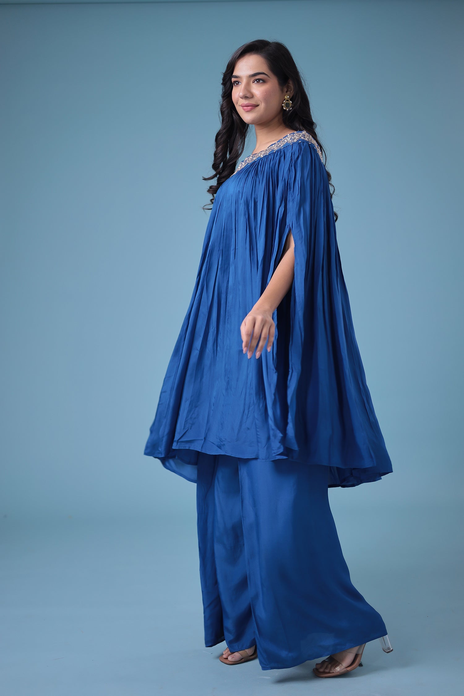 Exquisite Crop Top with Palazzo and a Draping Skirt Embellished with Zari and Dori work