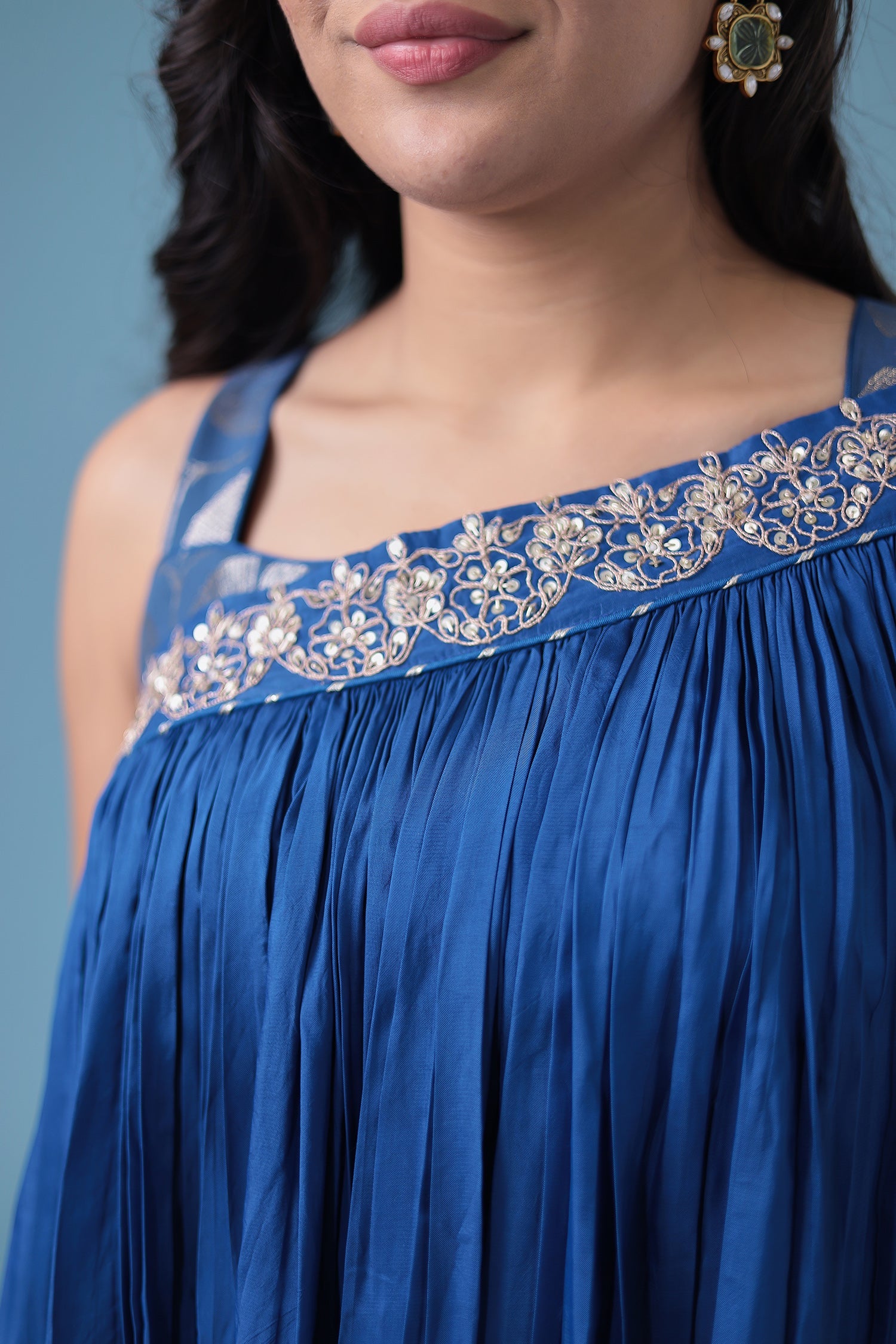 Exquisite Crop Top with Palazzo and a Draping Skirt Embellished with Zari and Dori work