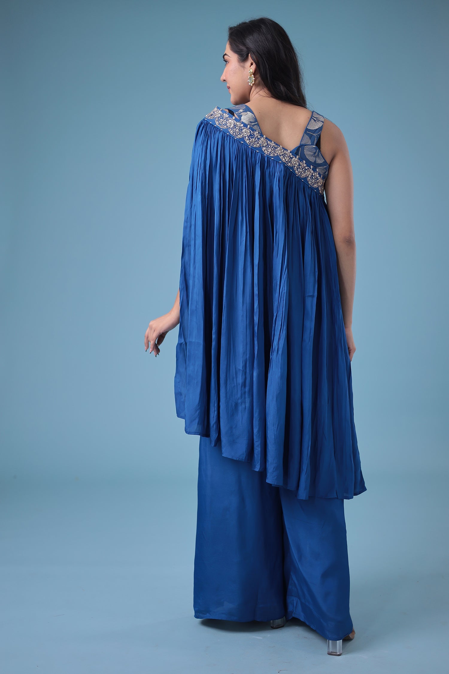 Exquisite Crop Top with Palazzo and a Draping Skirt Embellished with Zari and Dori work