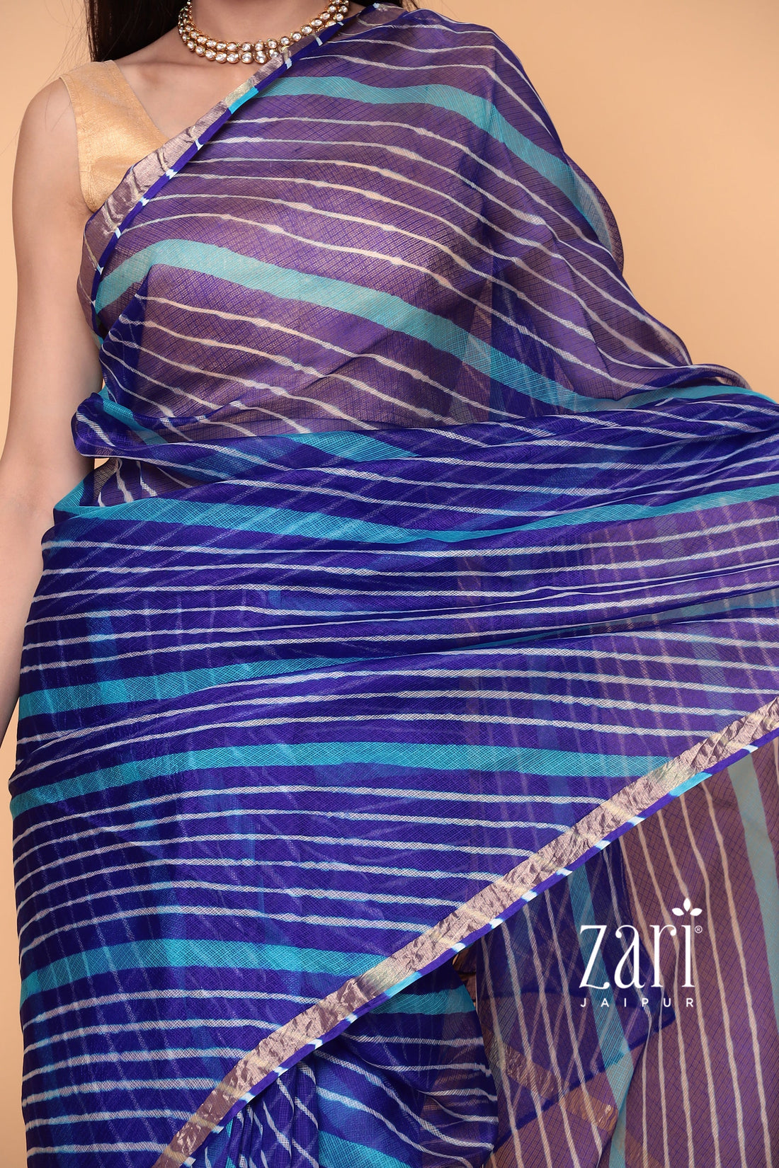 Kota Doria Silk Leheriya Saree with Zari work.