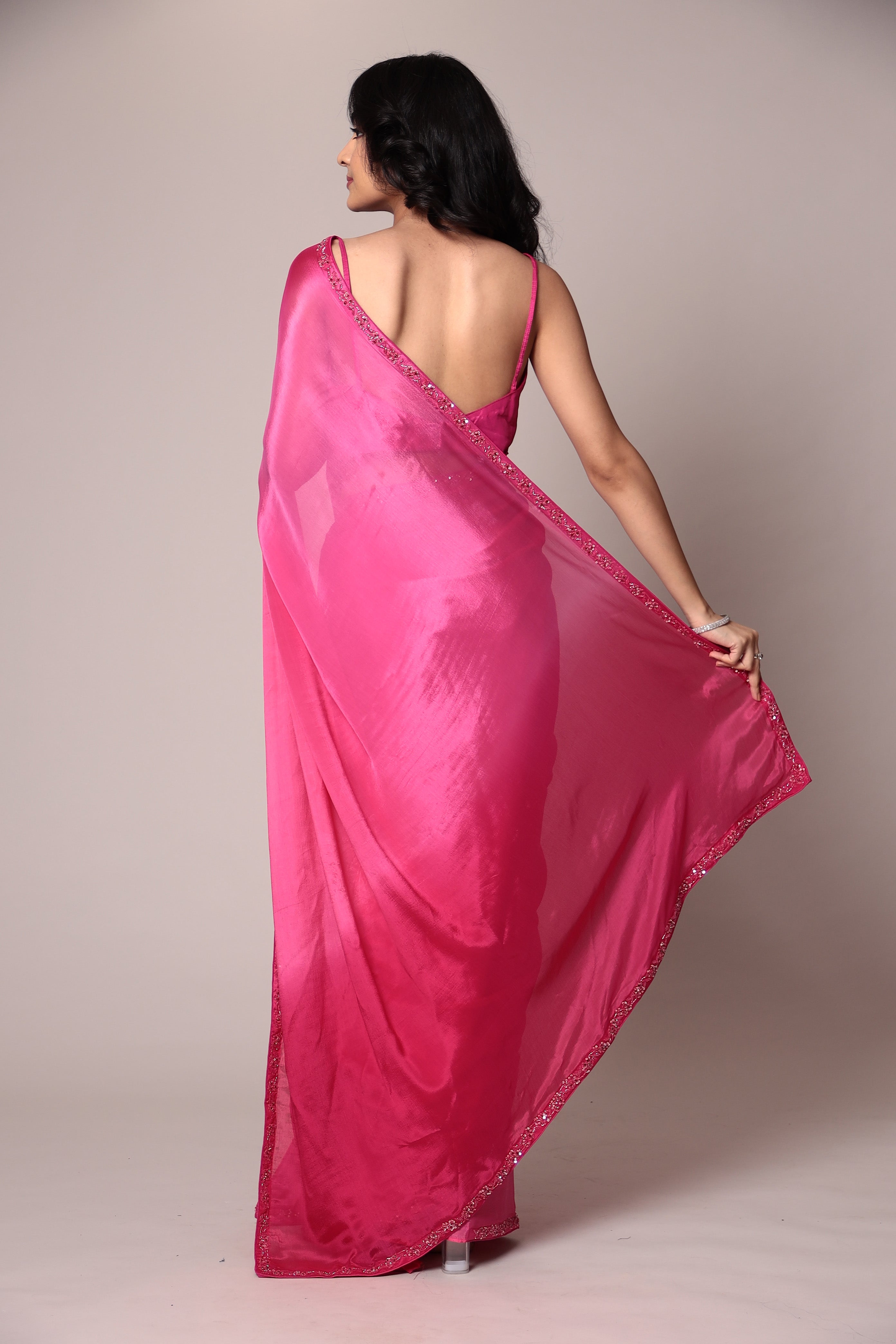 Exquisite Silk Saree adorned with intricate Cutdana embellishments.