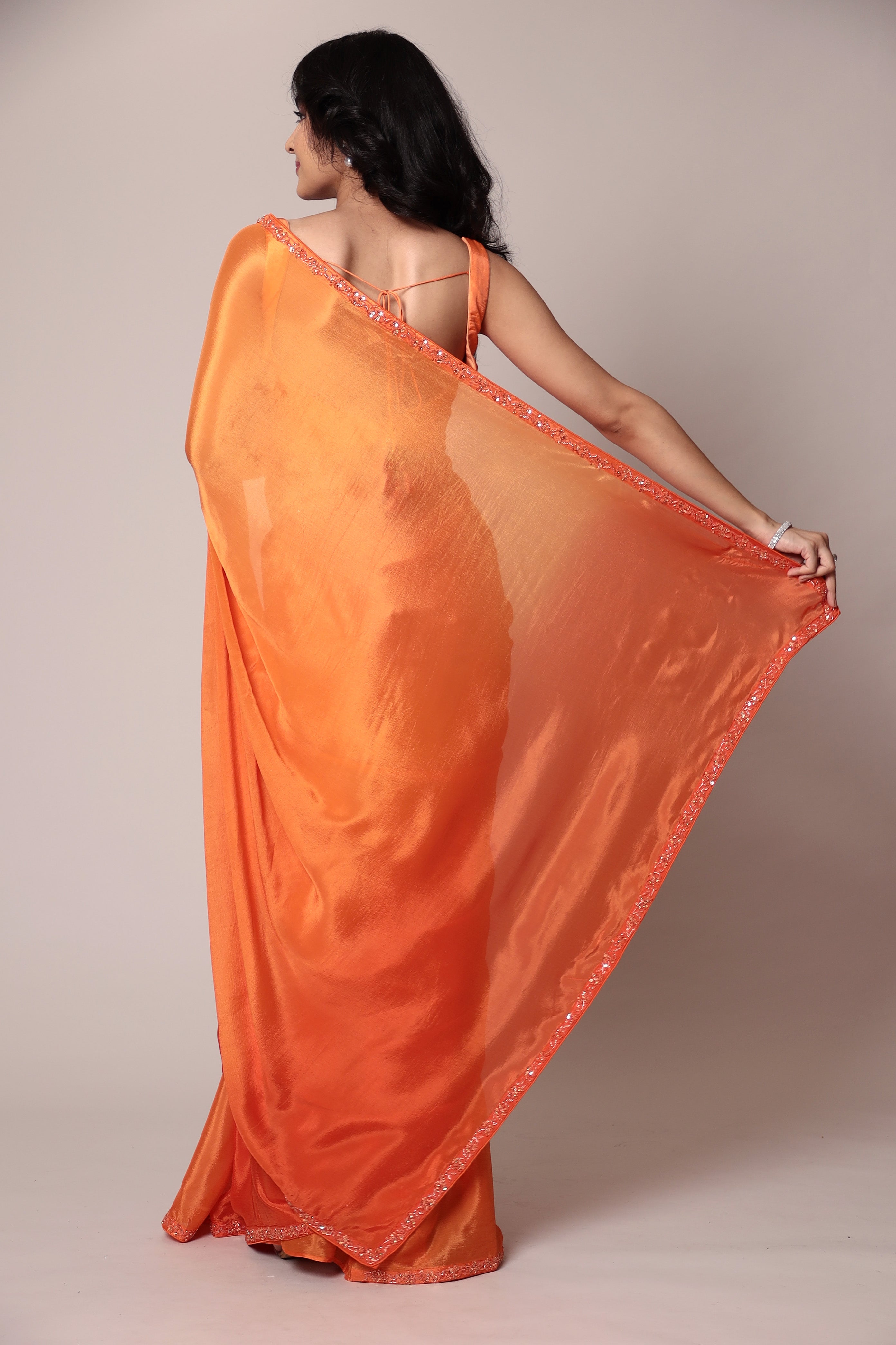 Exquisite Silk Saree adorned with intricate Cutdana embellishments.