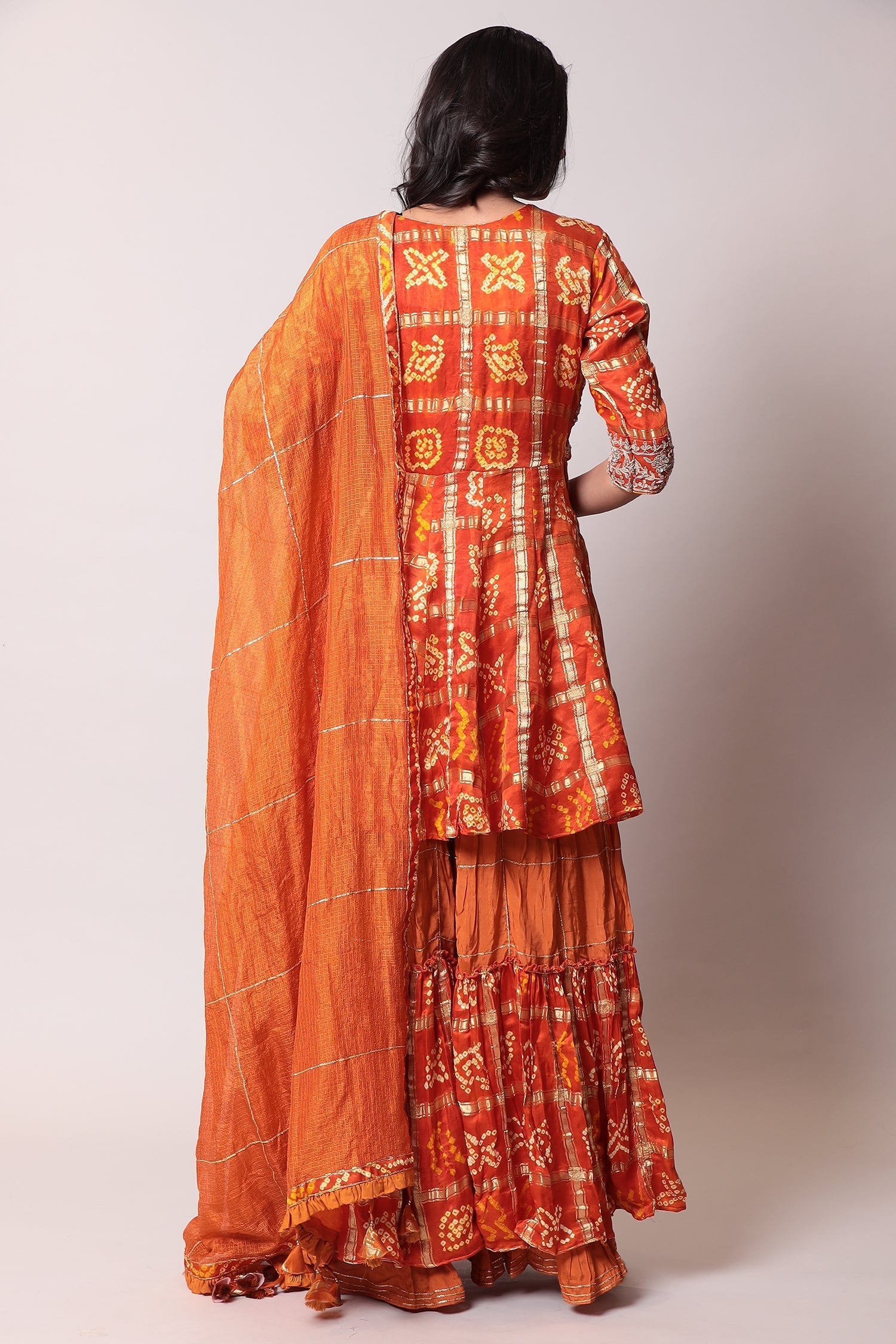 Peplum Ghatchola Bandhej silk Suit with Gota Patti work.