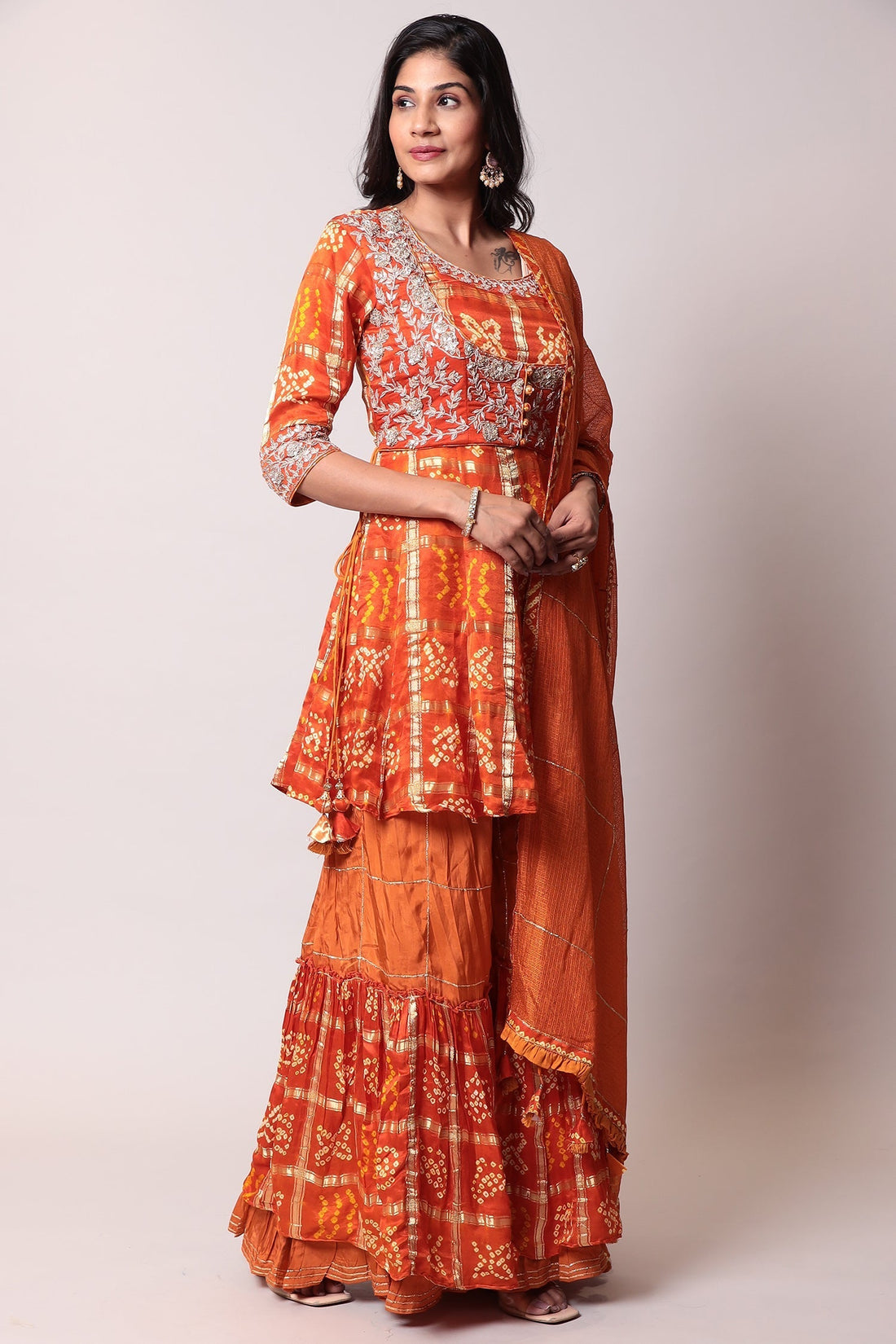 Peplum Ghatchola Bandhej silk Suit with Gota Patti work.