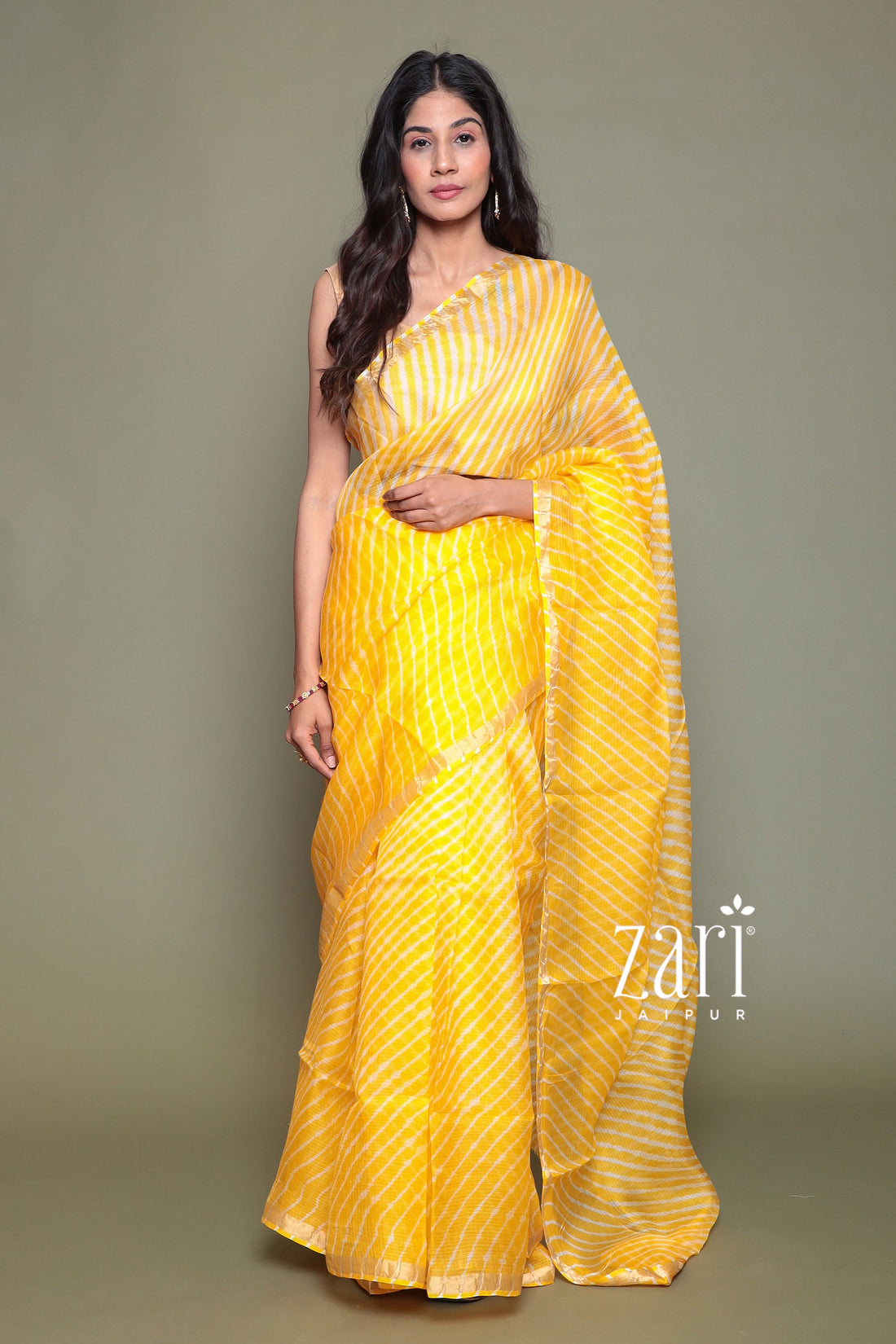 Kota Doria Silk Leheriya Saree with Zari work.
