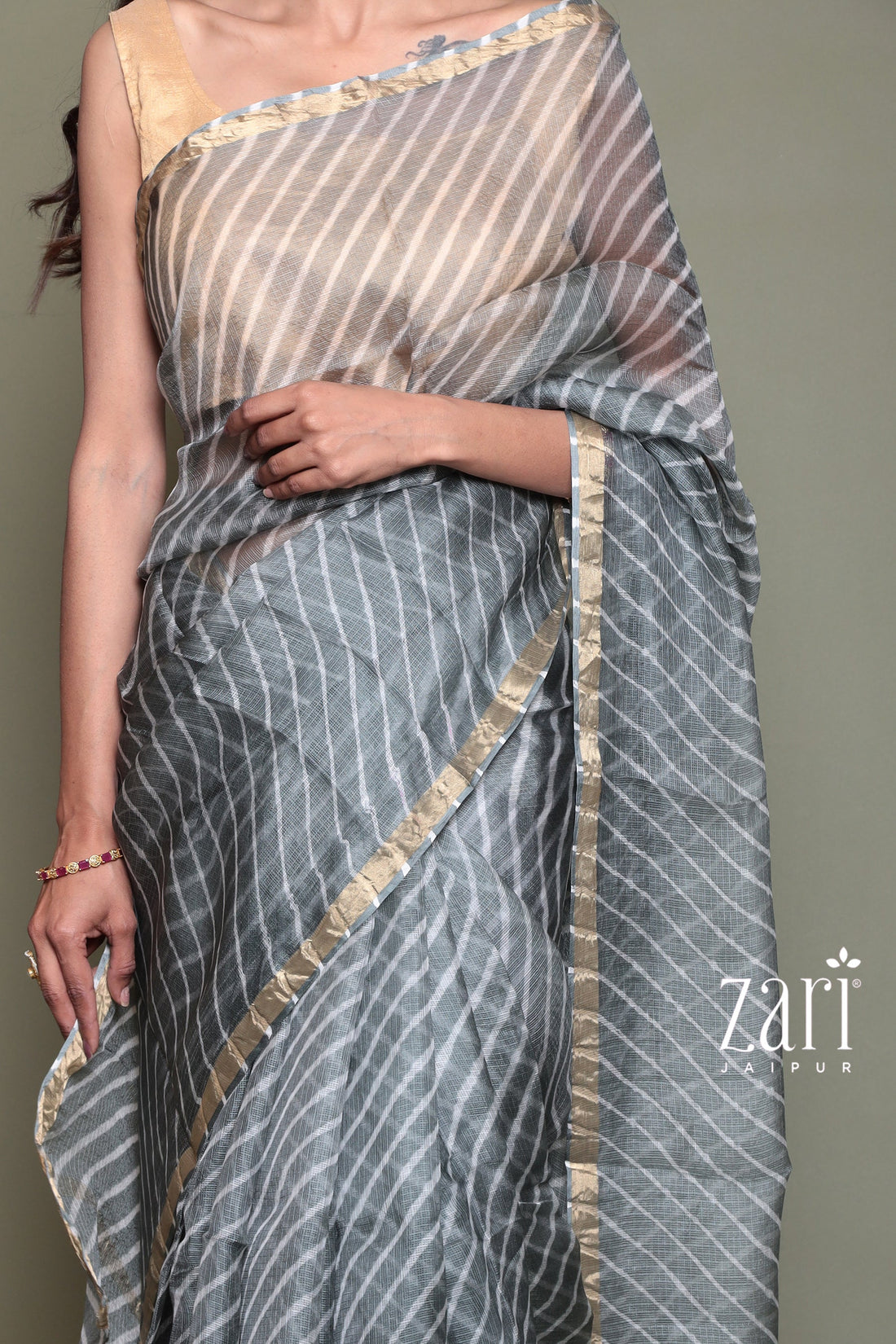 Kota Doria Silk Leheriya Saree with Zari work.