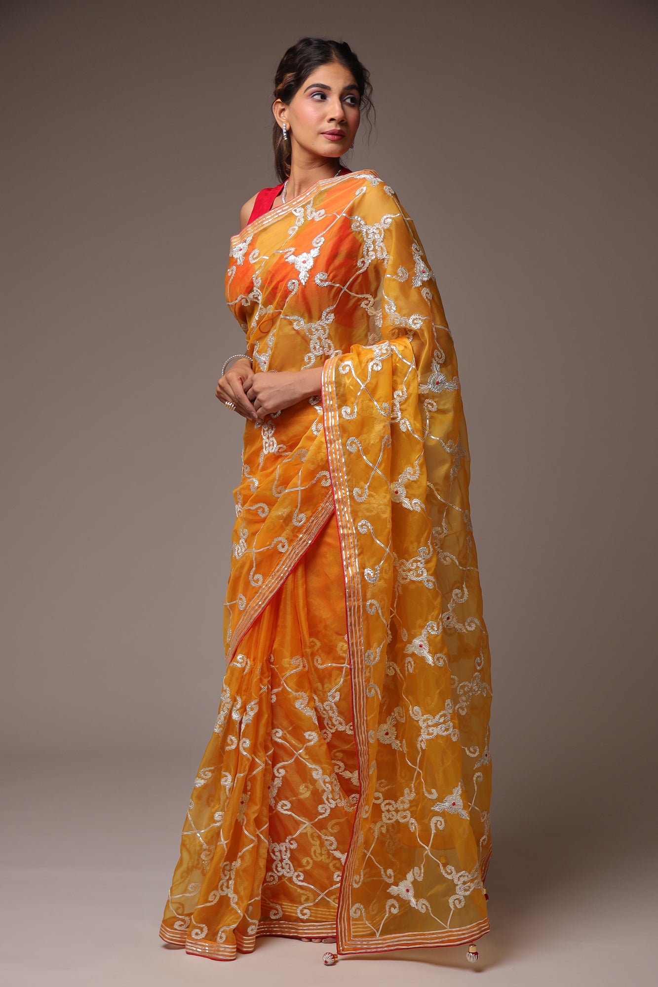 Exquisite Organza Saree with Intricate Gota Embellishments.