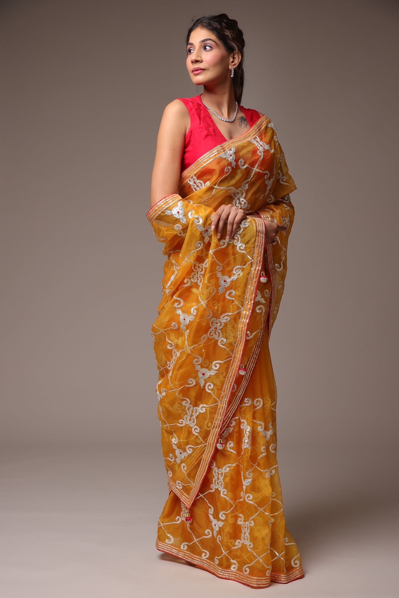 Exquisite Organza Saree with Intricate Gota Embellishments.
