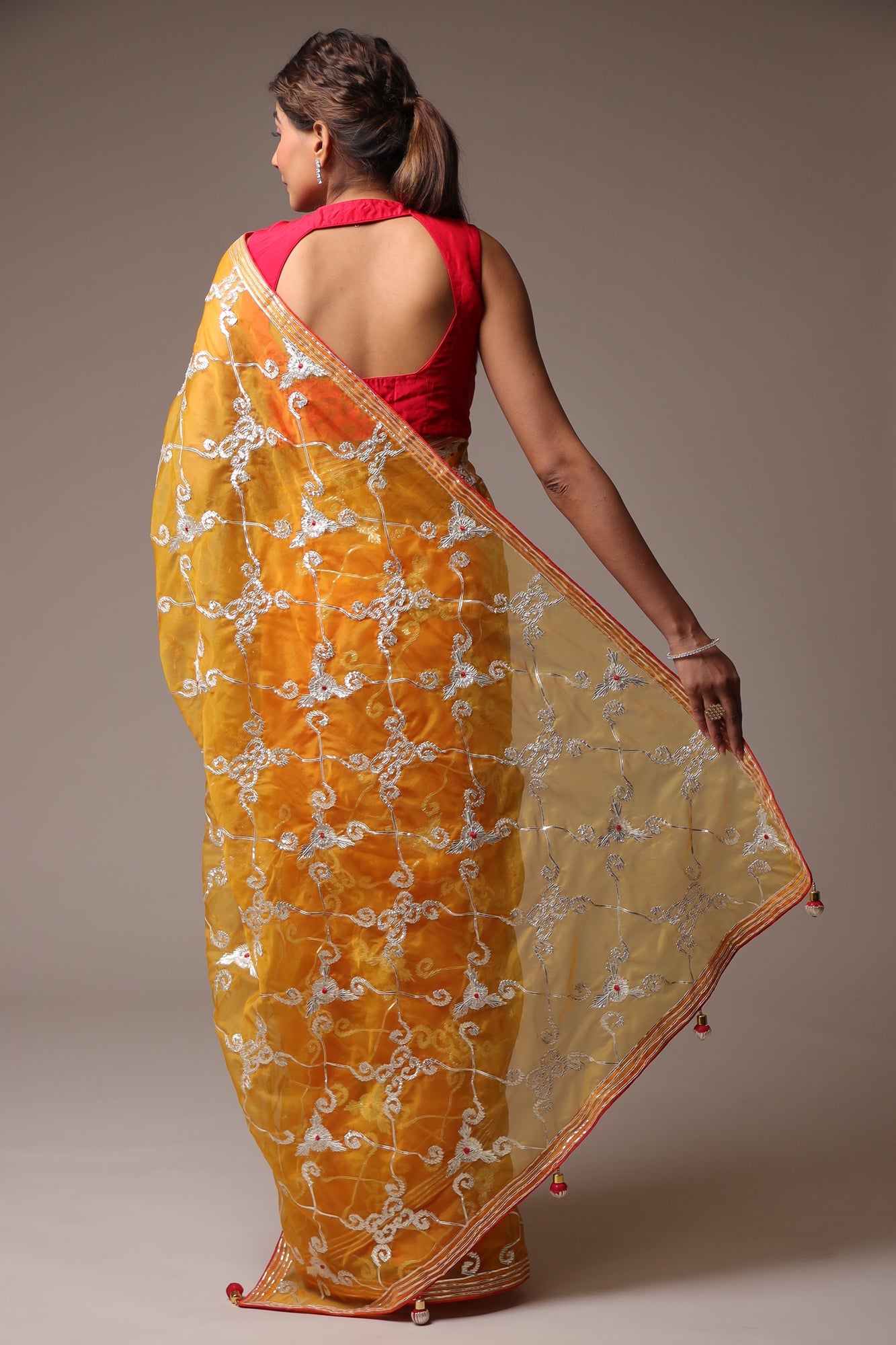Exquisite Organza Saree with Intricate Gota Embellishments.
