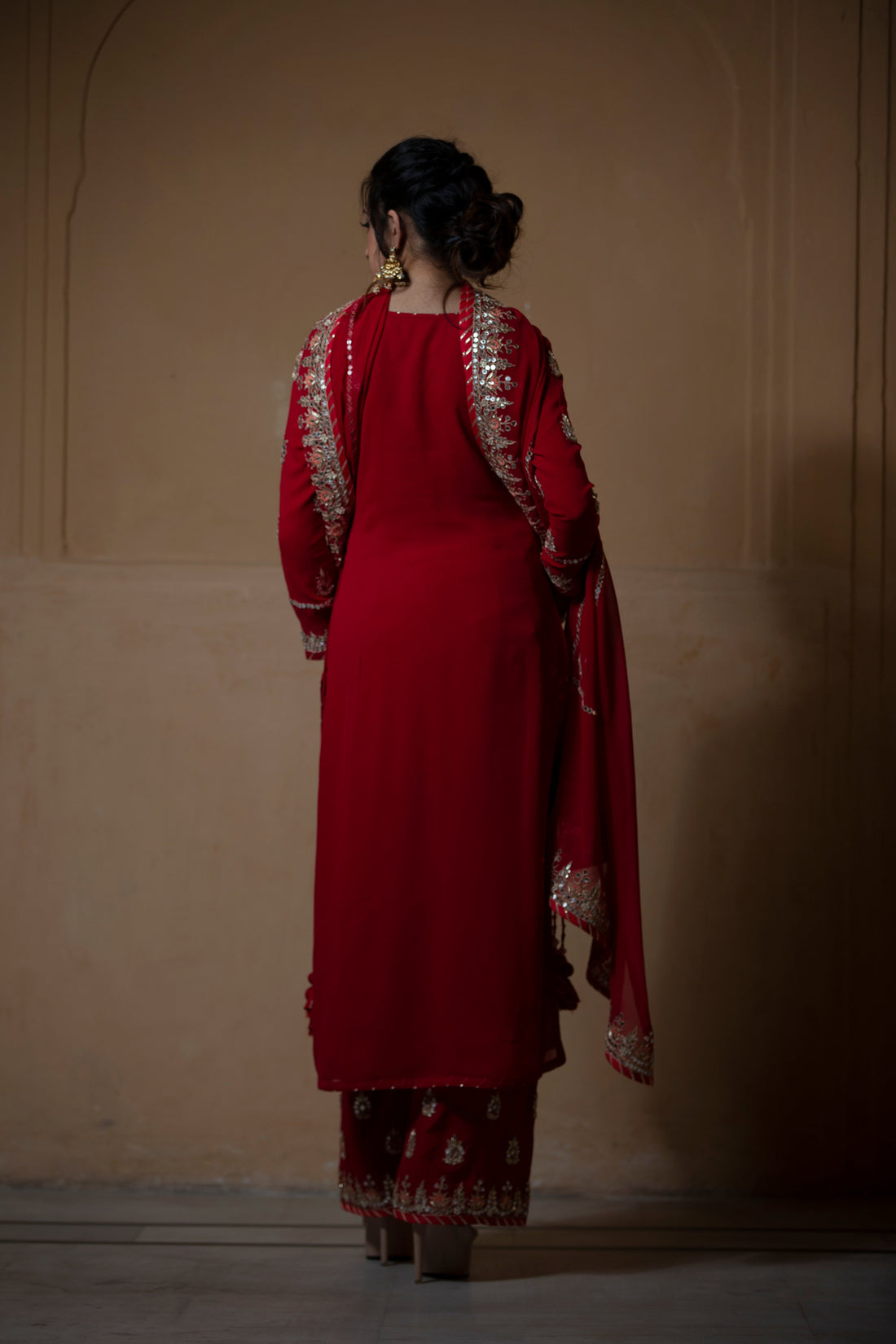 Exquisite Georgette Suit adorned with Gota Patti ,Thread, and Zardozi Embellishments.