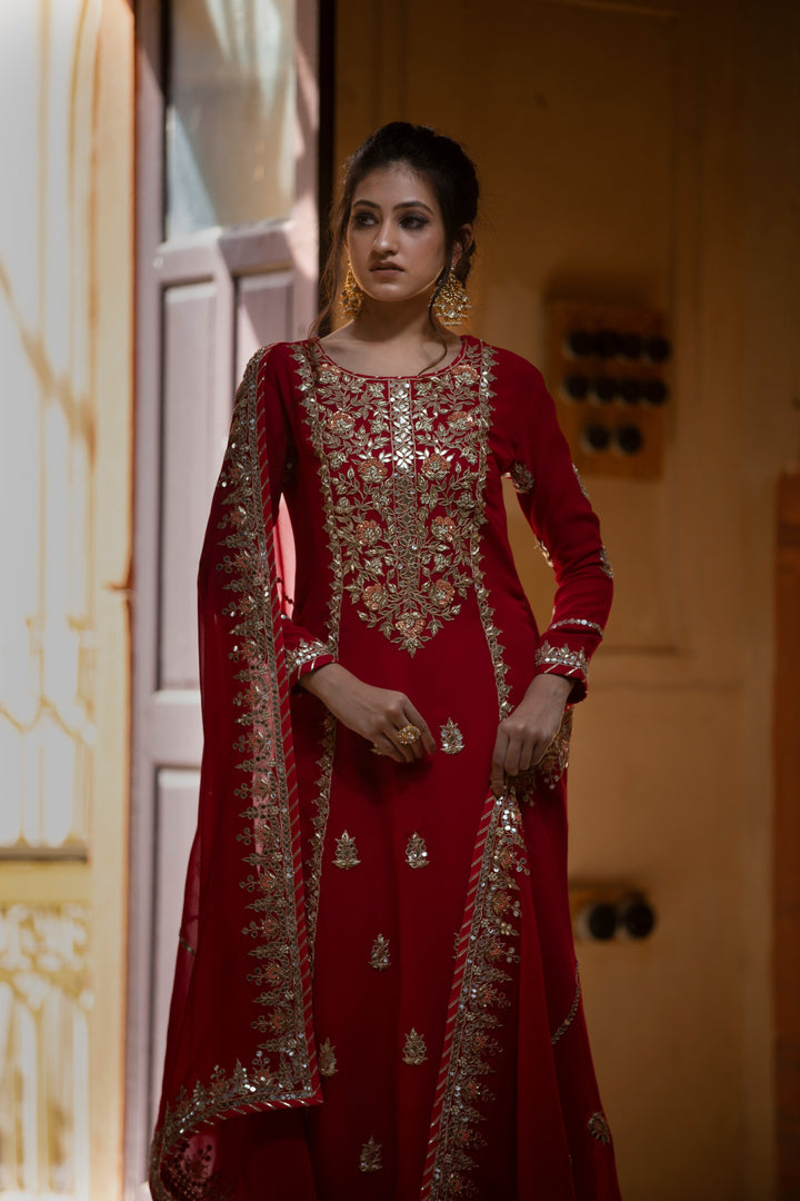 Exquisite Georgette Suit adorned with Gota Patti ,Thread, and Zardozi Embellishments.