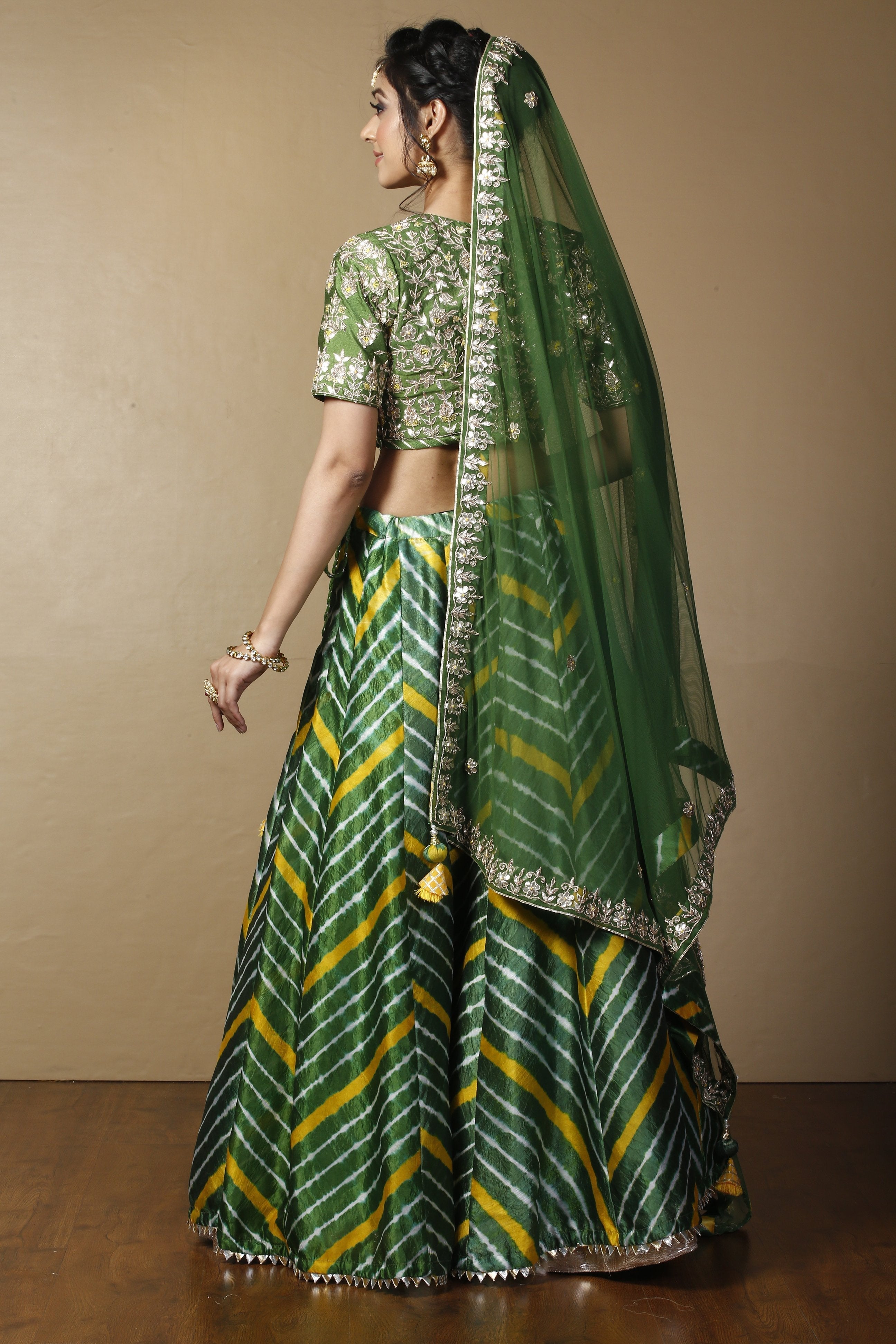 Tussar silk Lehenga in Dark Green color with Gota Patti, Thread, Zardozi work.