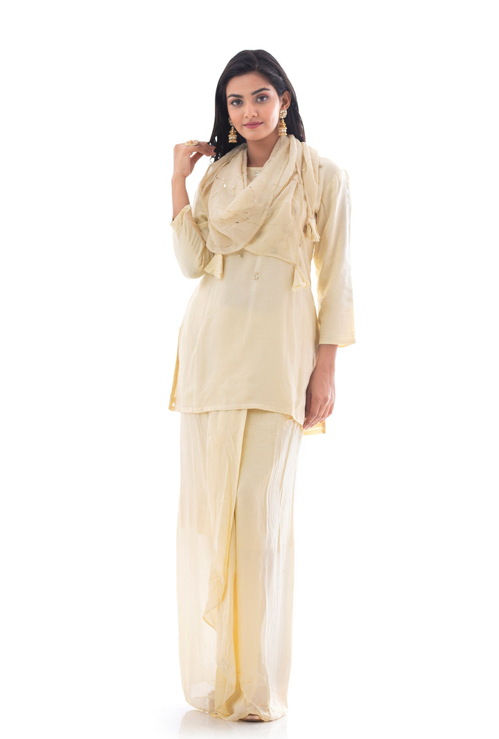 Suits in Cream color with Sequins work.