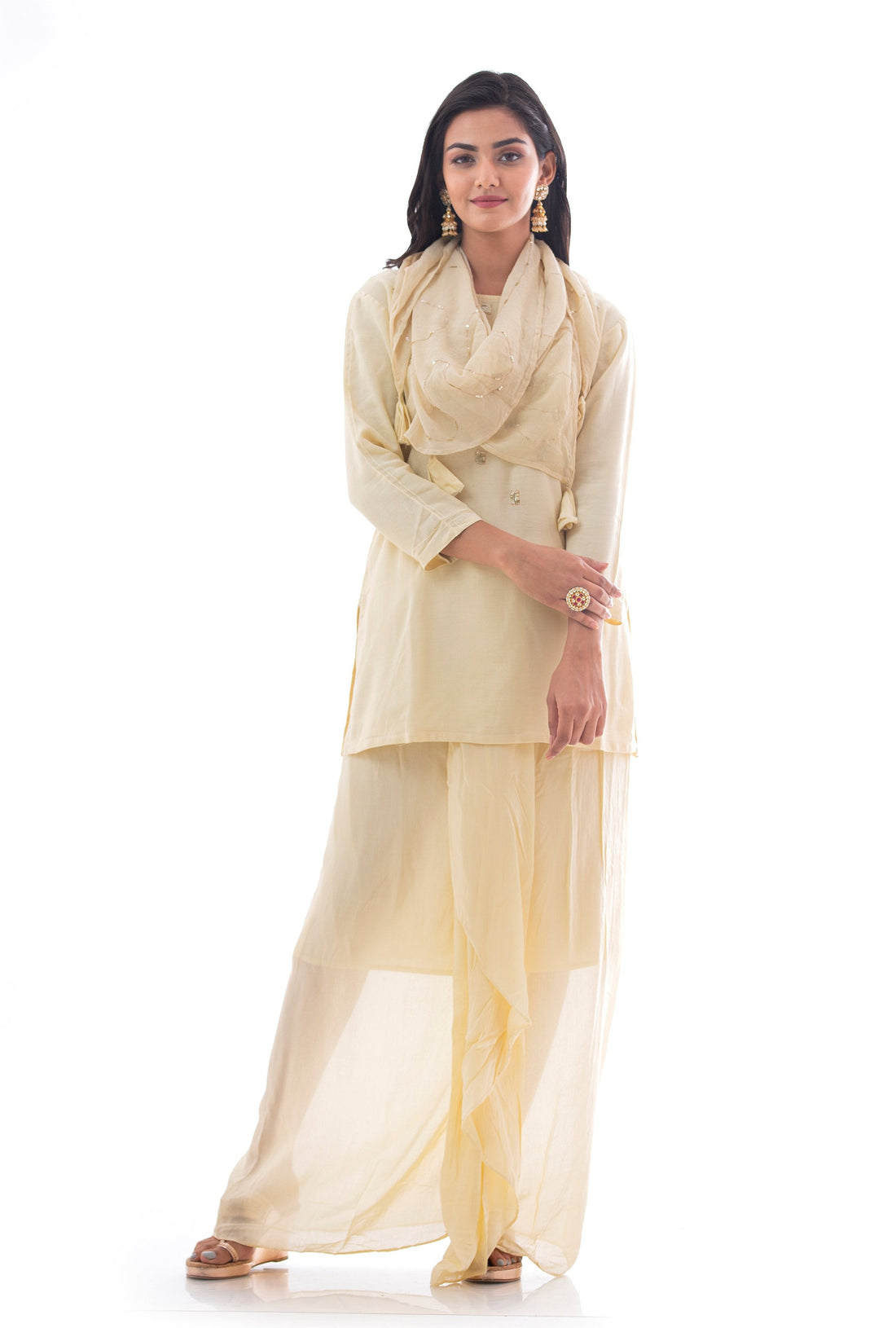 Suits in Cream color with Sequins work.