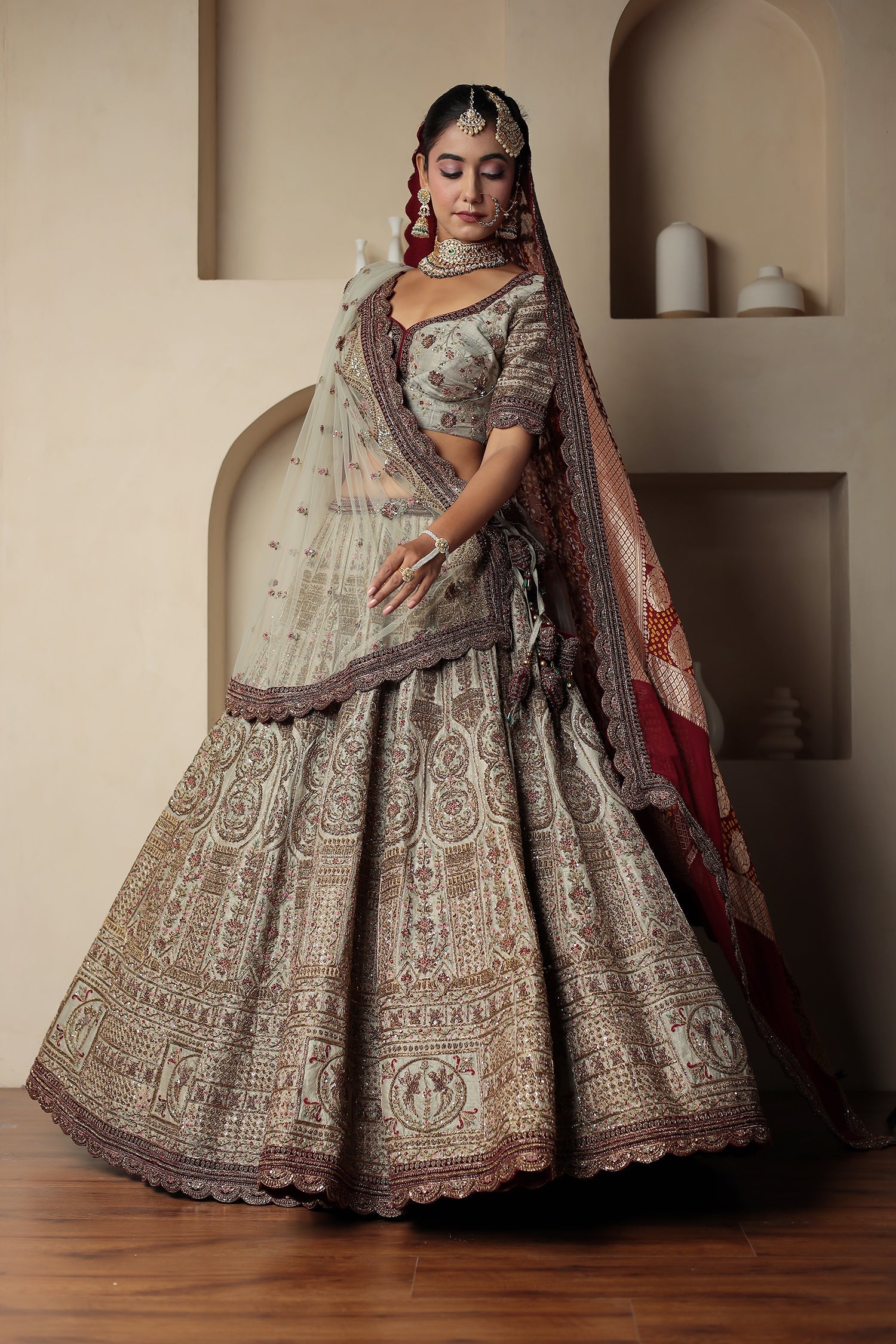 Raw Silk Bridal Lehenga Traditionally Enhanced with Contrast Bandhej Dupatta