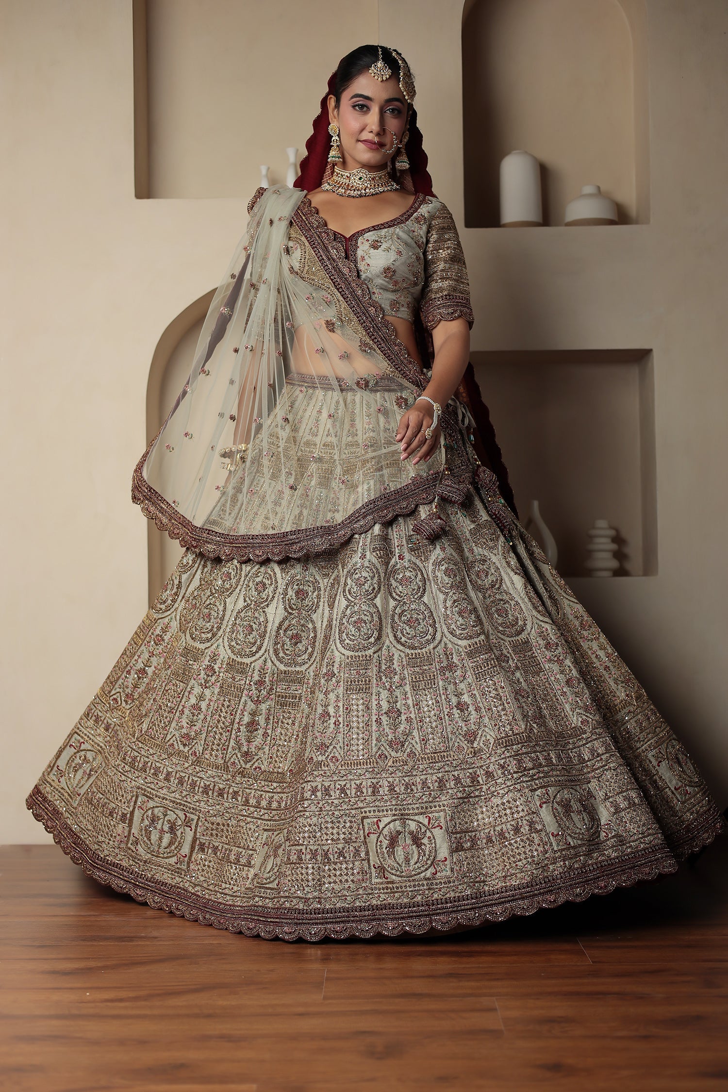 Raw Silk Bridal Lehenga Traditionally Enhanced with Contrast Bandhej Dupatta