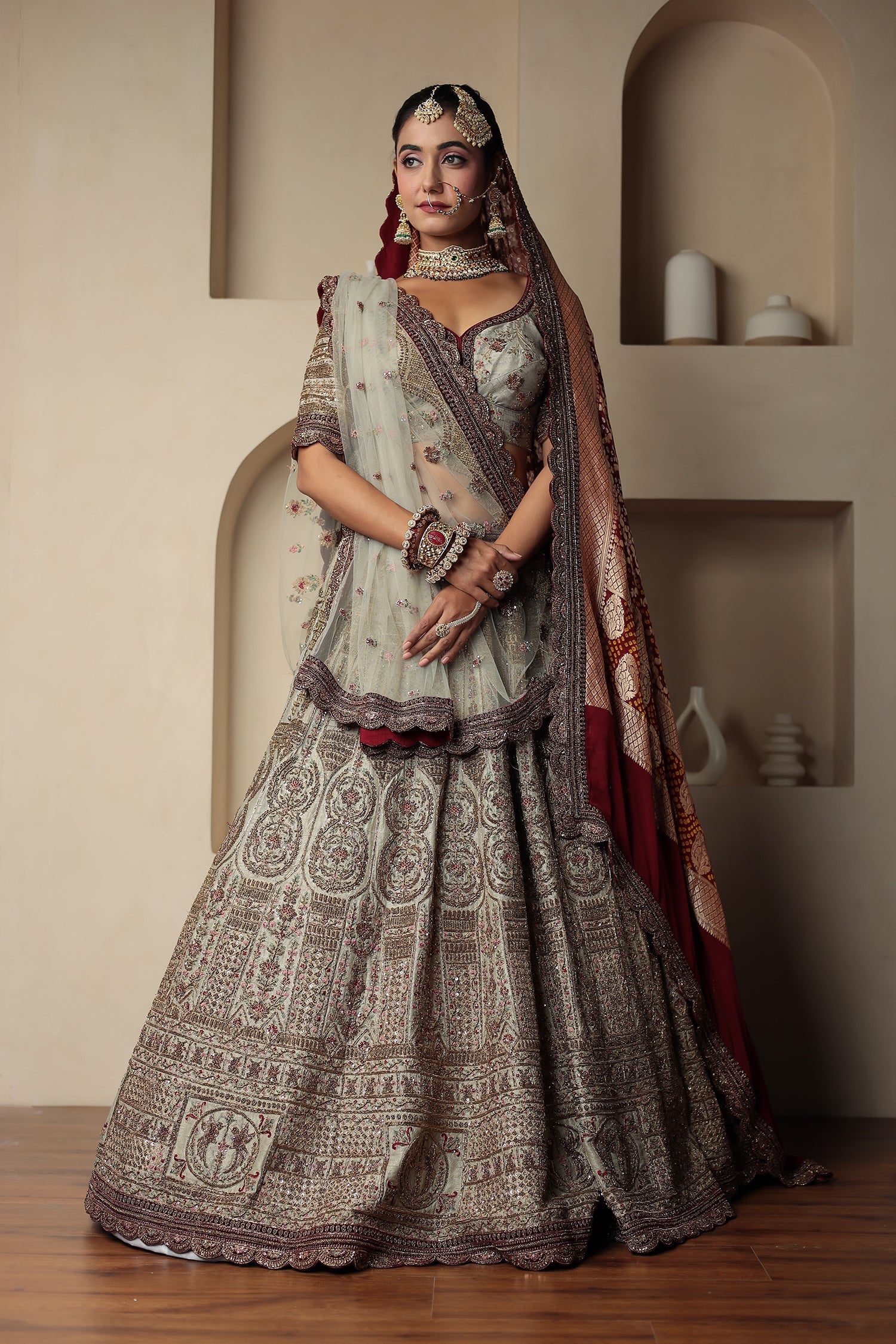 Raw Silk Bridal Lehenga Traditionally Enhanced with Contrast Bandhej Dupatta