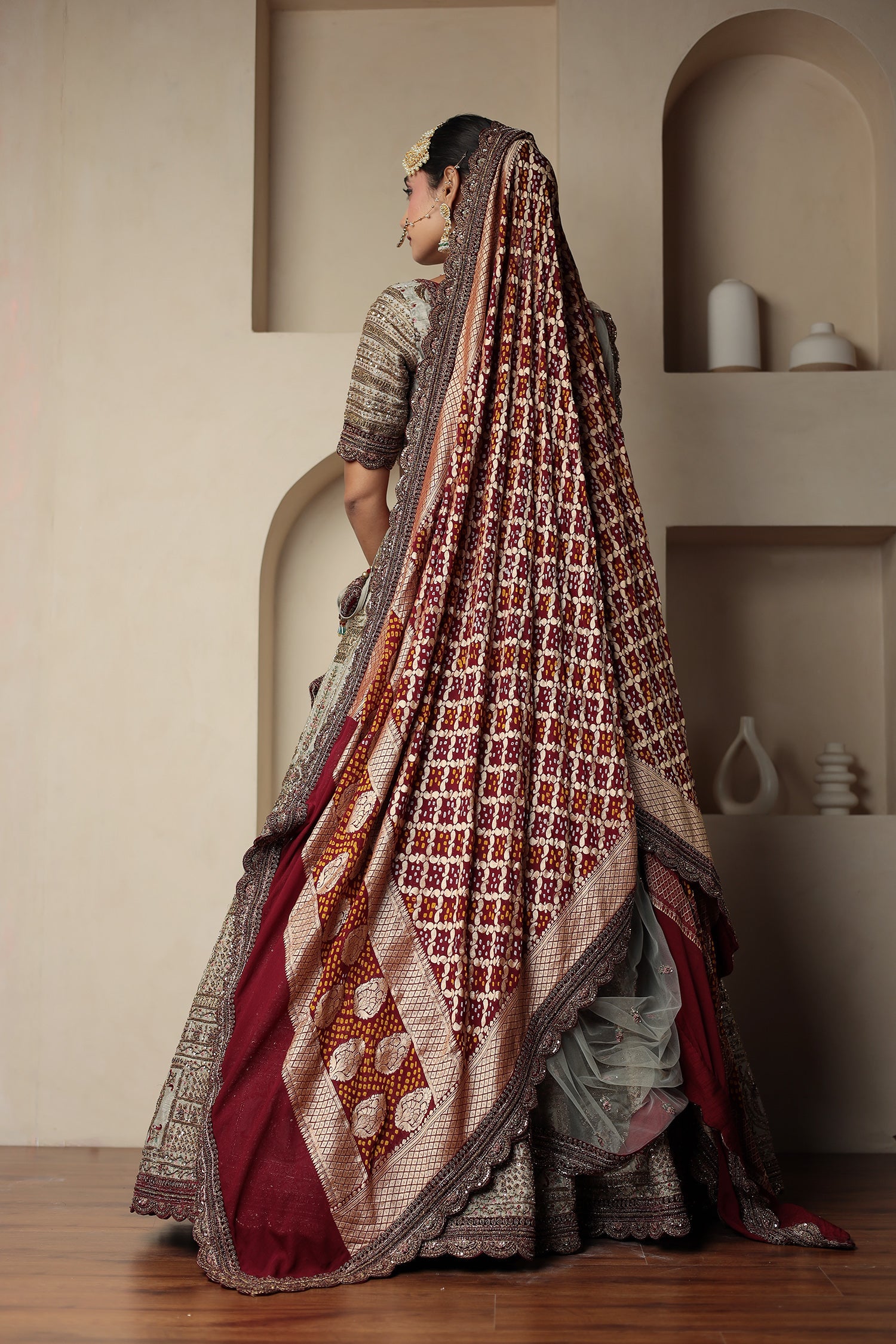 Raw Silk Bridal Lehenga Traditionally Enhanced with Contrast Bandhej Dupatta