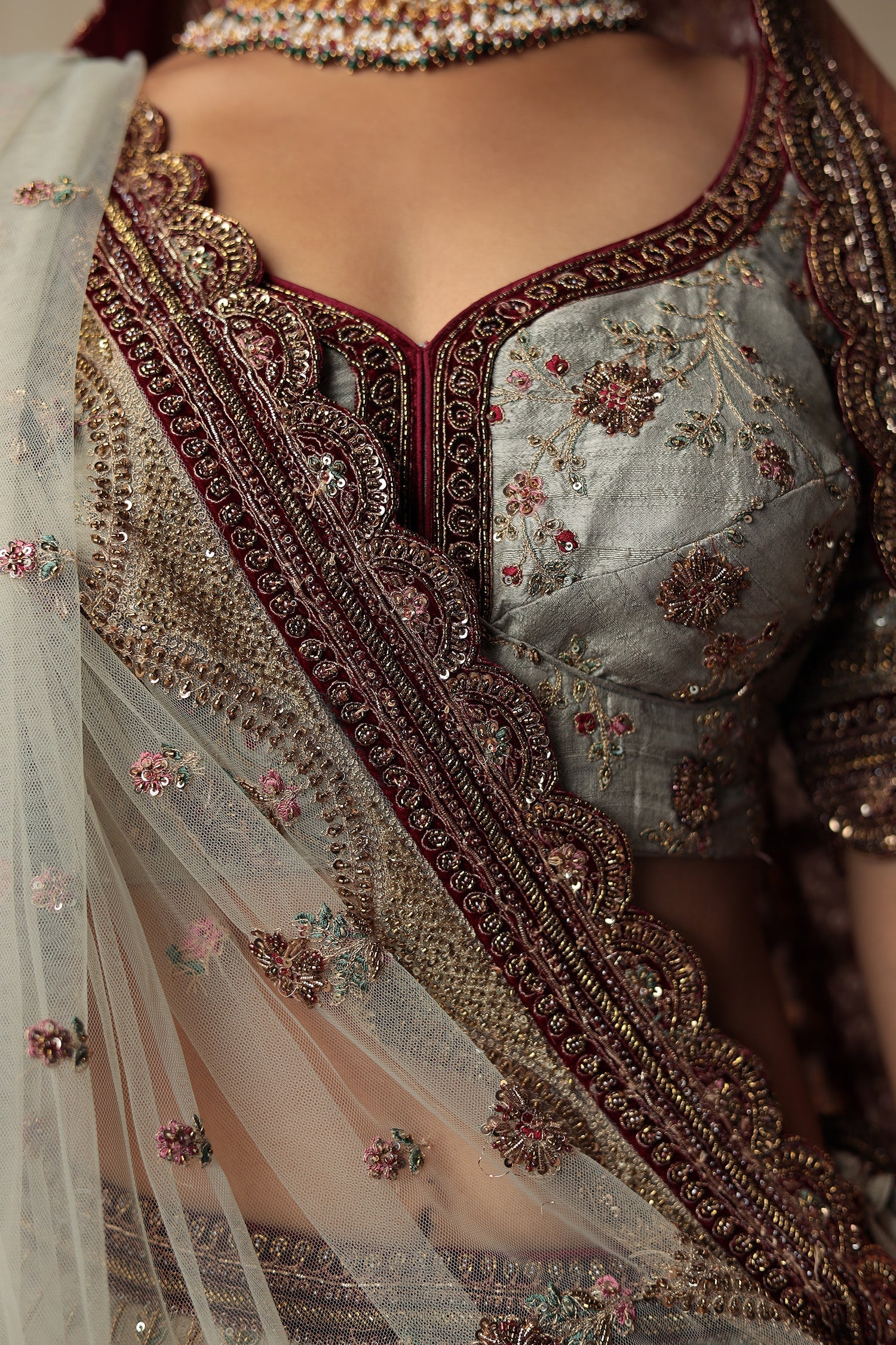 Raw Silk Bridal Lehenga Traditionally Enhanced with Contrast Bandhej Dupatta