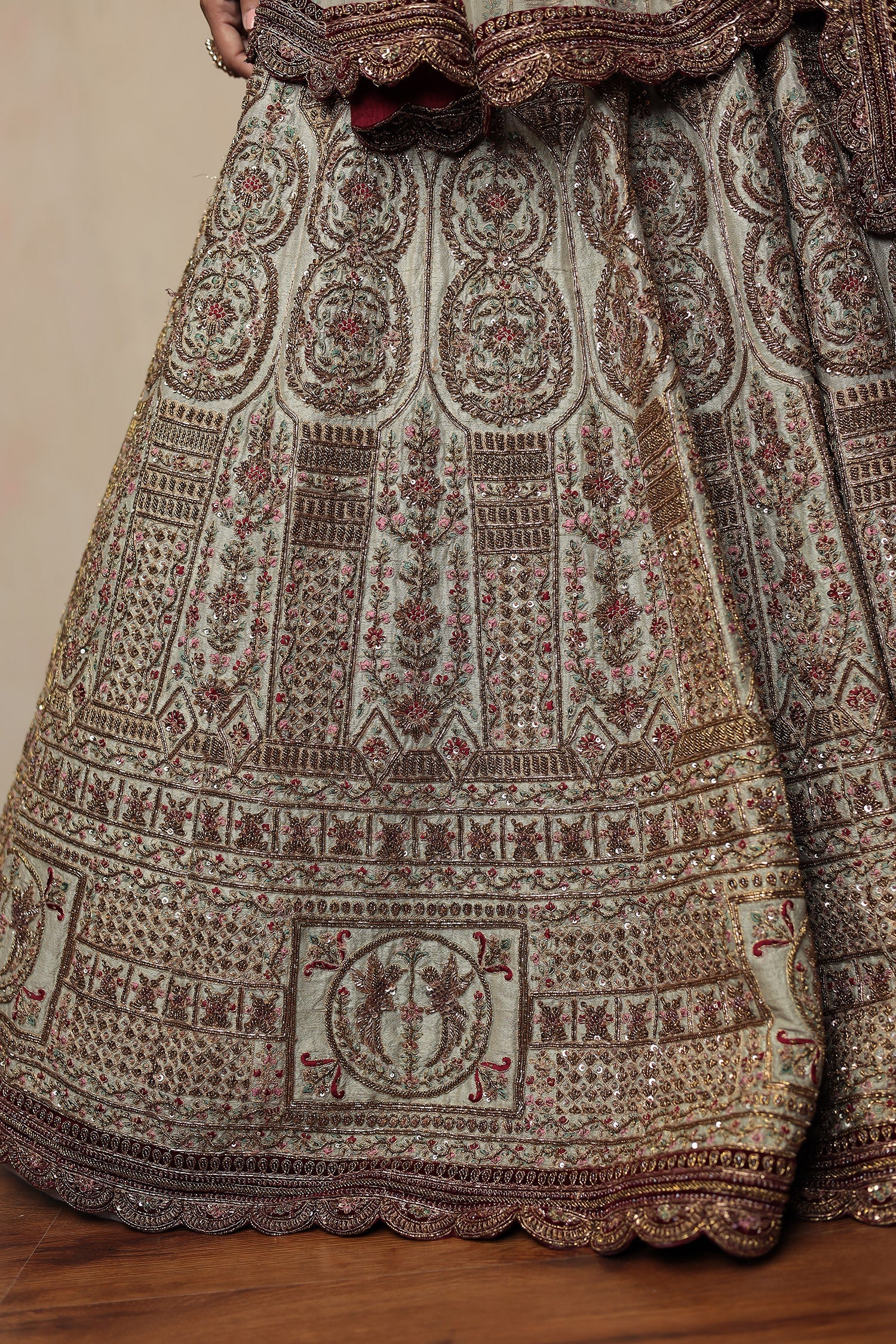 Raw Silk Bridal Lehenga Traditionally Enhanced with Contrast Bandhej Dupatta