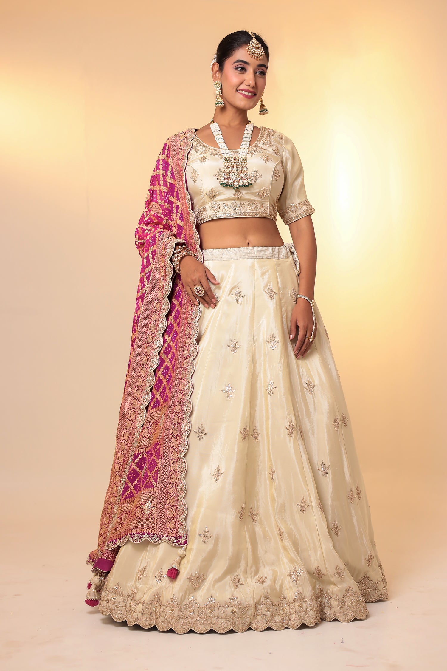 Tissue Lehenga with Bandhej duppatta.