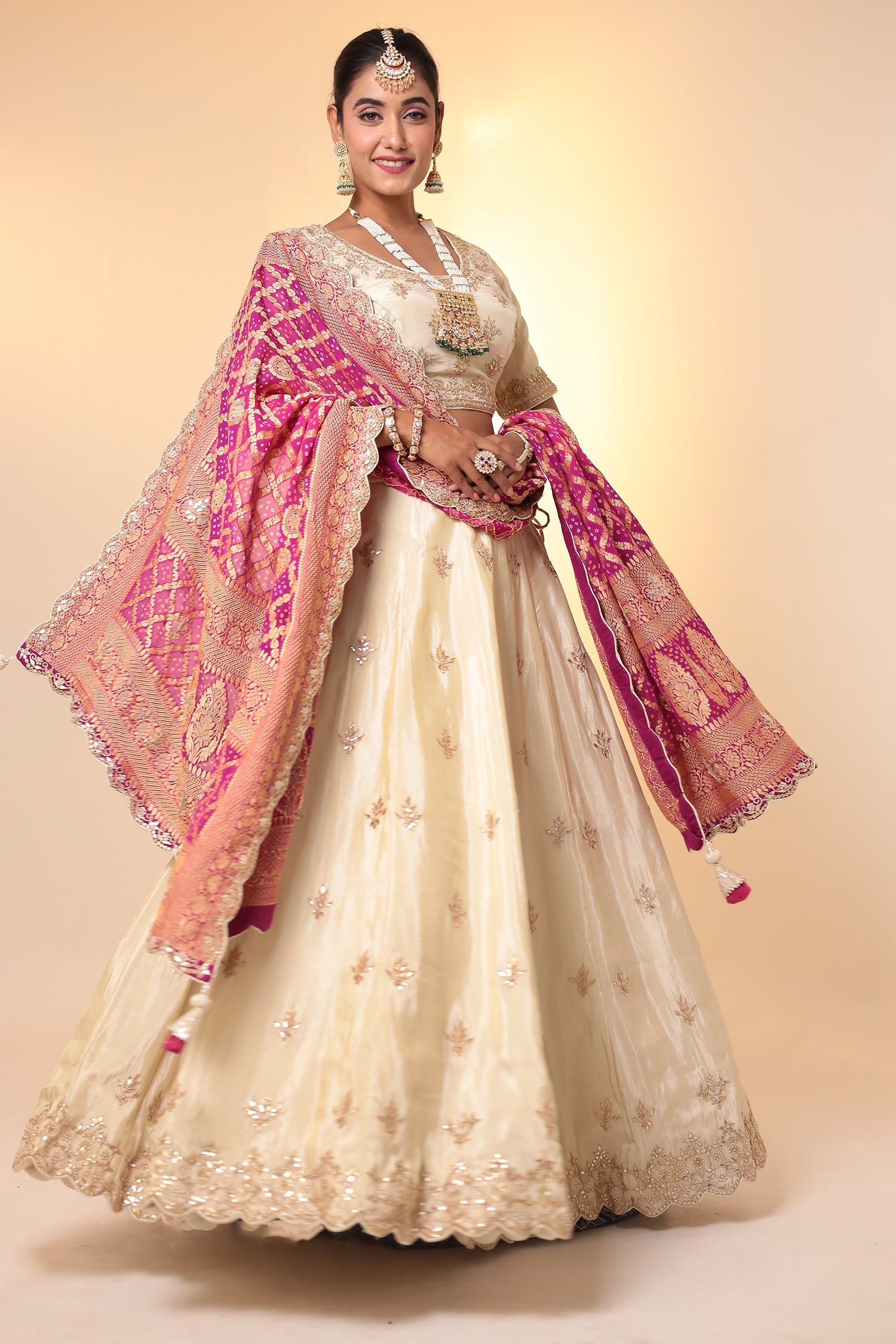 Tissue Lehenga with Bandhej duppatta.