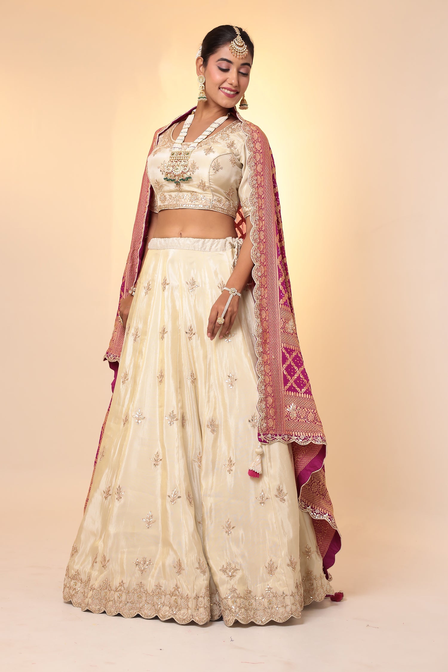 Tissue Lehenga with Bandhej duppatta.