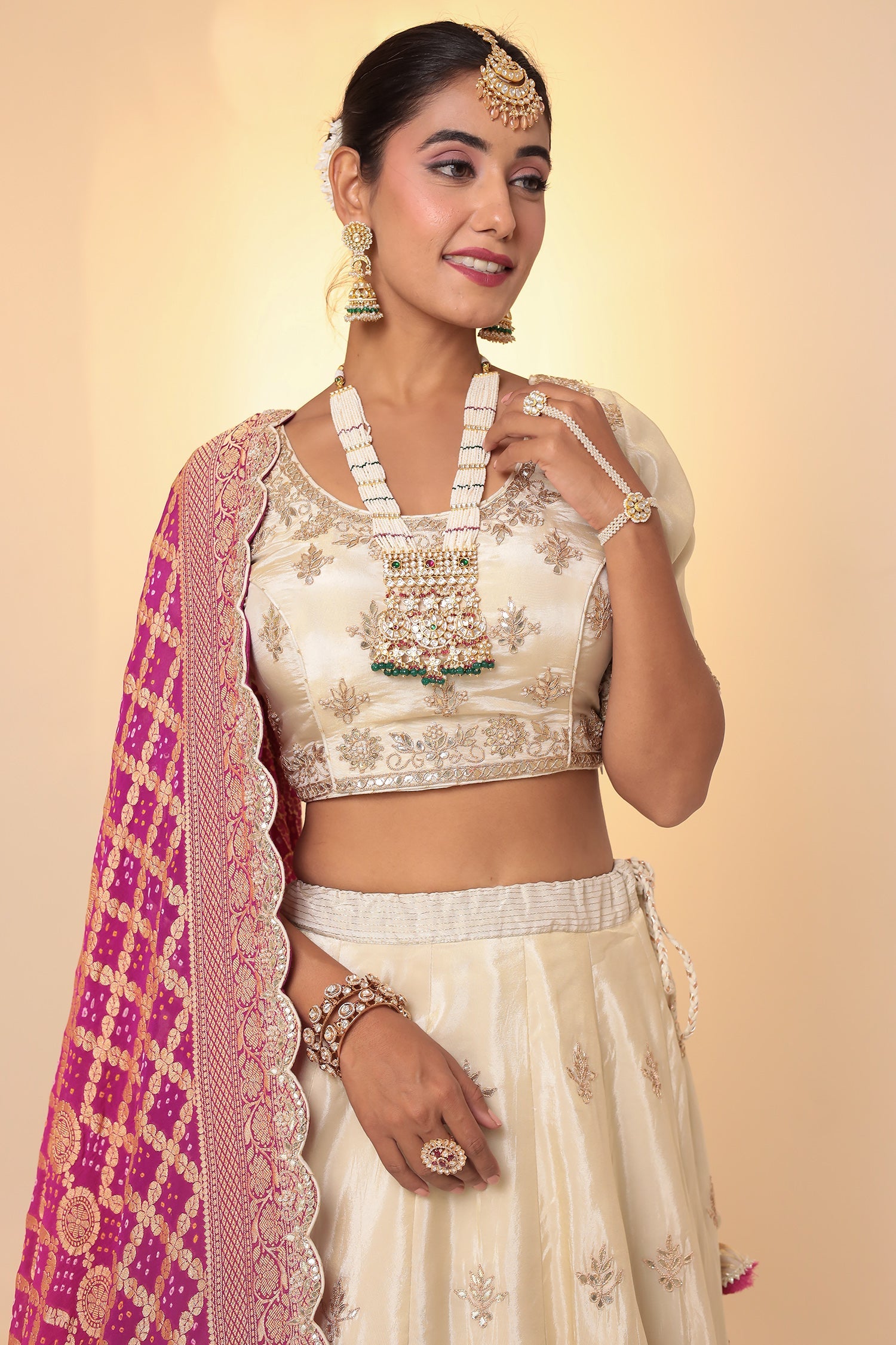 Tissue Lehenga with Bandhej duppatta.