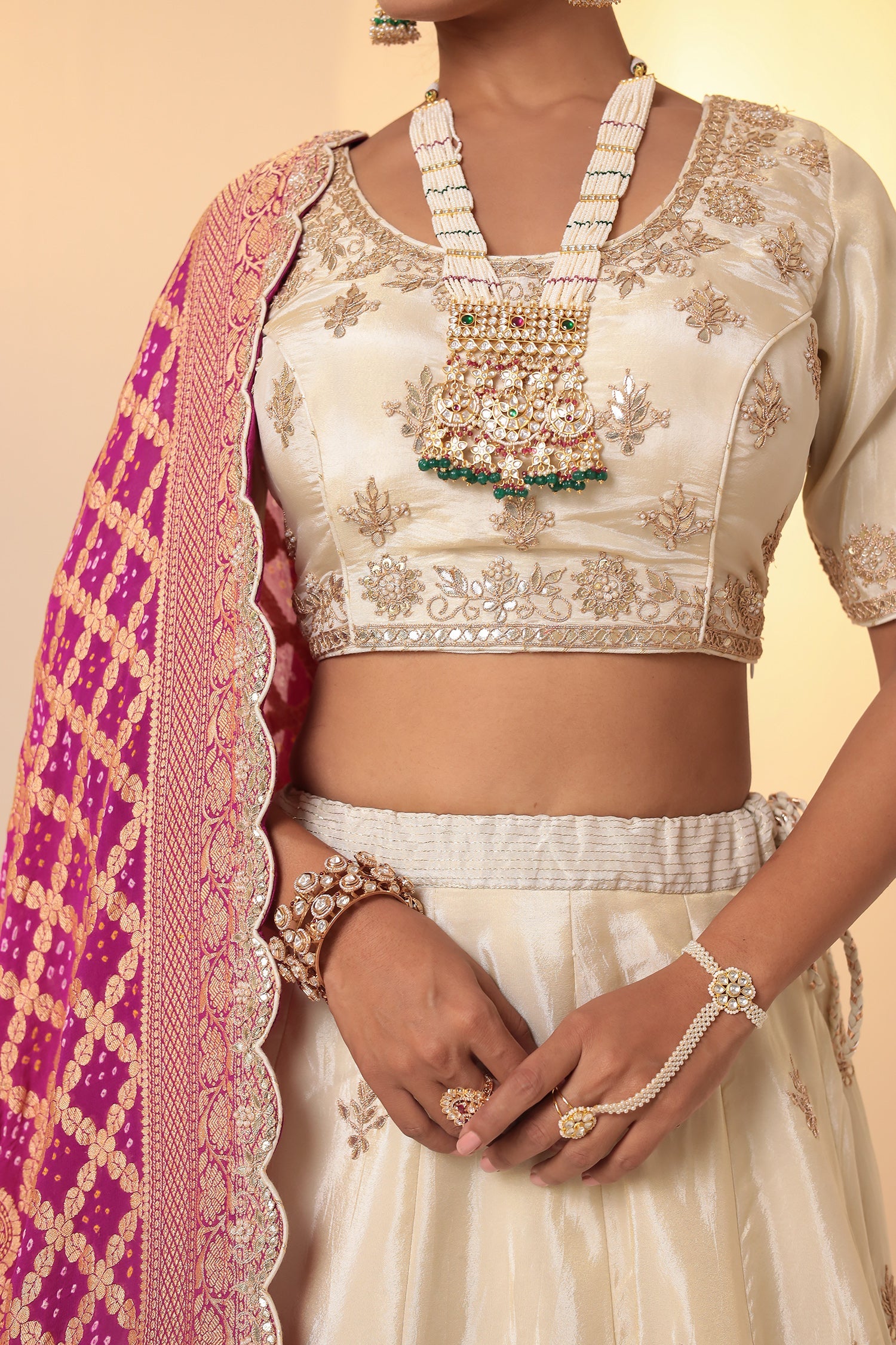 Tissue Lehenga with Bandhej duppatta.